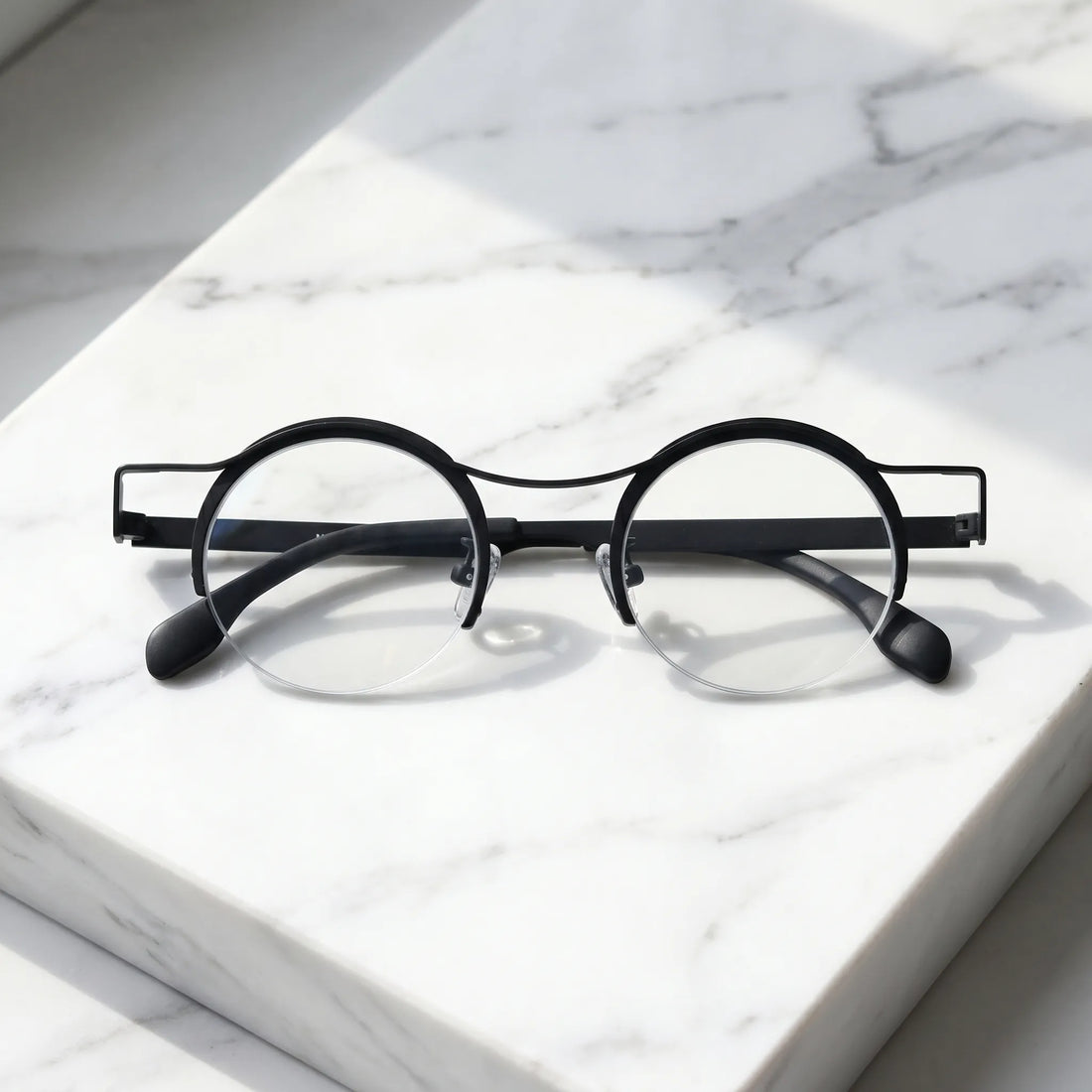 Barledear Classic Noir eyeglasses folded display showing slim black titanium temples and lightweight frame structure