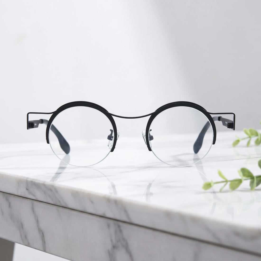 Barledear Classic Noir eyeglasses shown in a clean lifestyle front view with minimalist retro round titanium frame