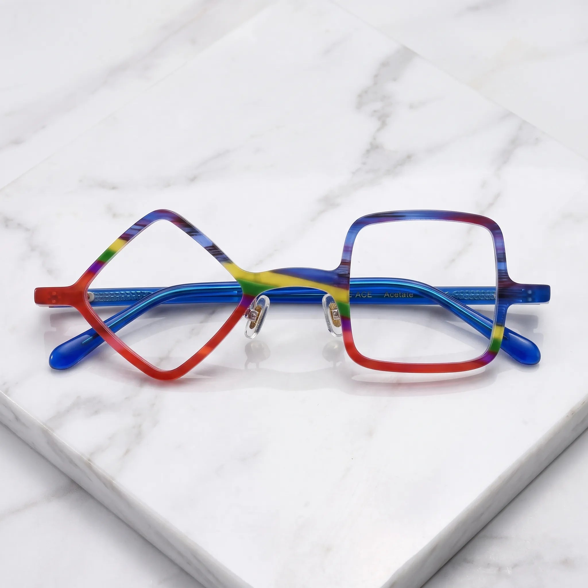 Barledear Cobalt Crimson asymmetric geometric acetate eyeglasses folded display showing the multicolor front, adjustable nose pads, and cobalt-blue temples.