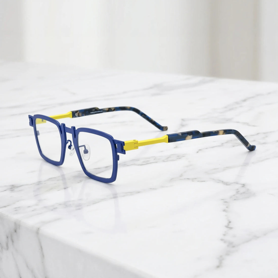 Barledear Cobalt Lemon Mosaic eyeglasses angled side view showing slim titanium temples, geometric side joint, and contrast temple detail