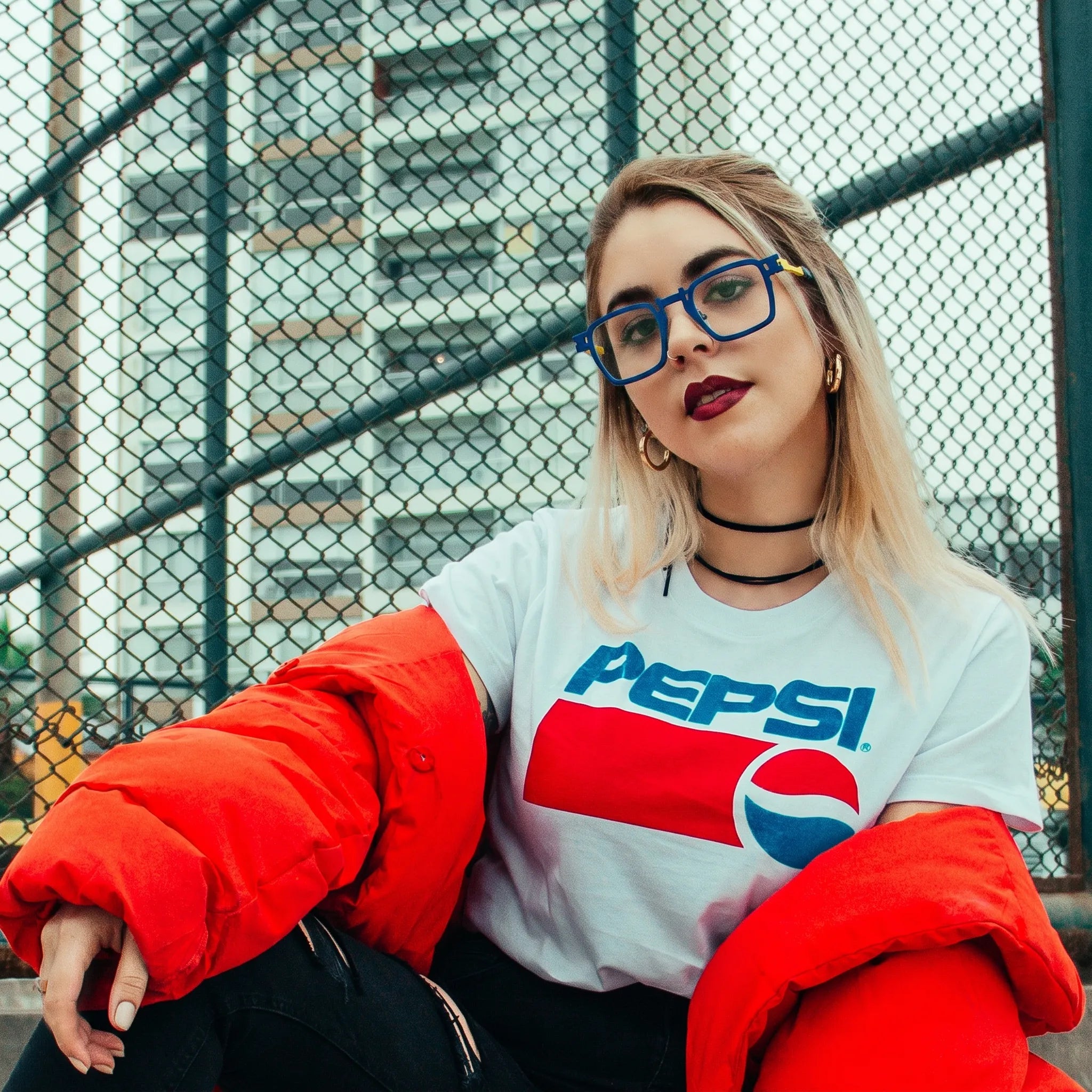 Model wearing Barledear Cobalt Lemon Mosaic geometric square titanium eyeglasses in a lifestyle portrait for statement daily wear