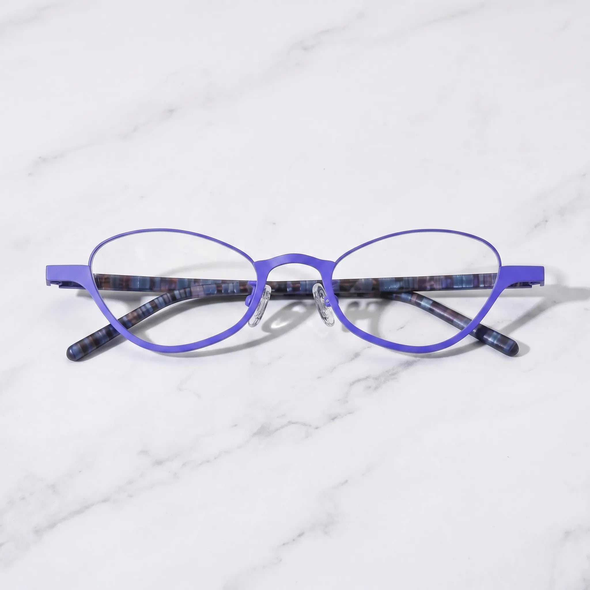 Barledear Cobalt Mosaic eyeglasses folded display showing dark patterned temples and lightweight titanium front
