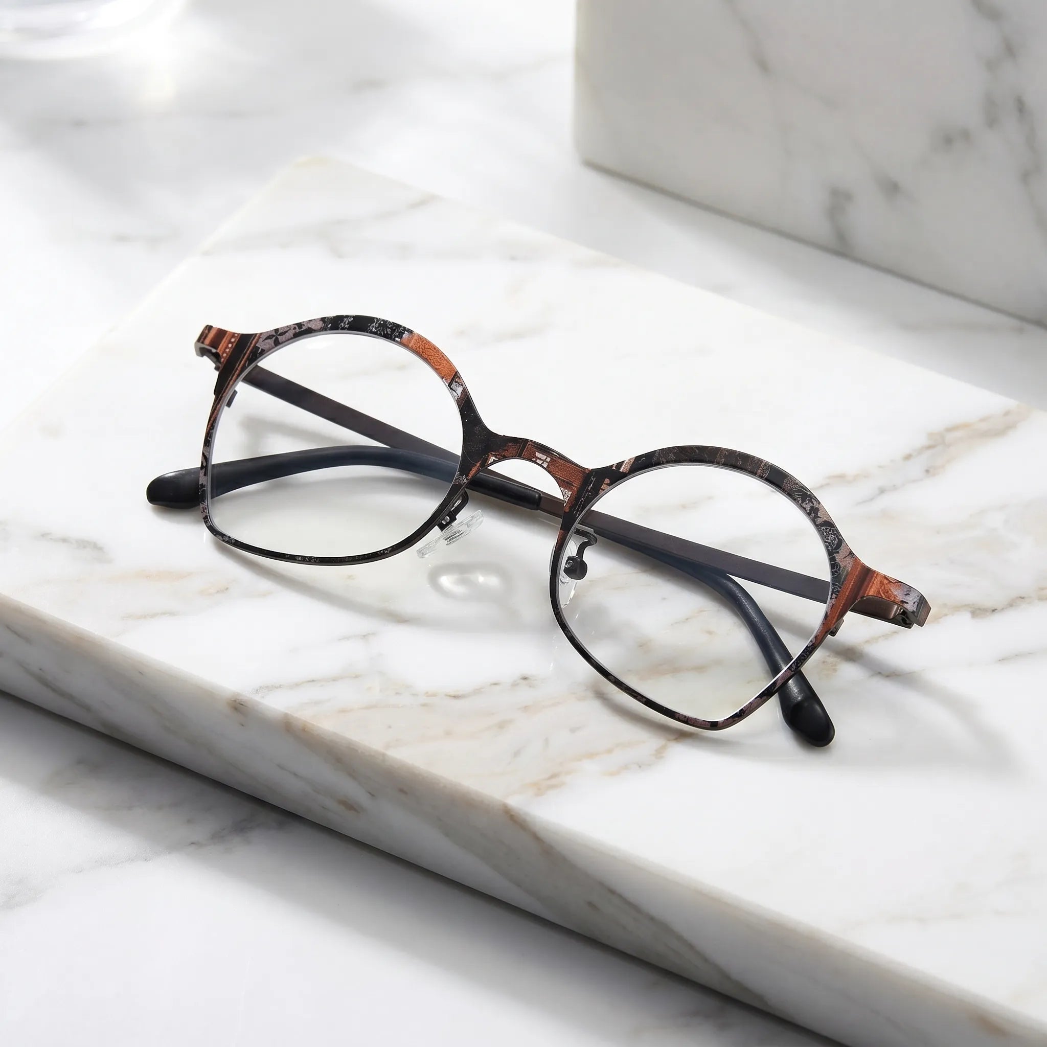 Barledear Copper Noir Brown eyeglasses folded display showing patterned titanium frame and slim temples