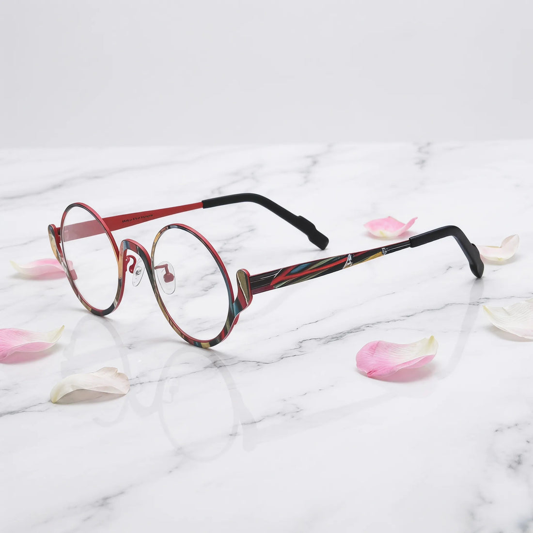 Barledear Crimson Artline eyeglasses angled side view showing slim temples, adjustable nose pads, and a lightweight round full-rim titanium frame