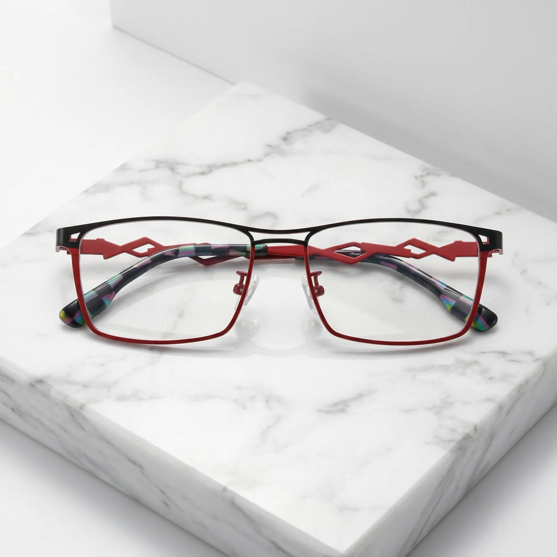 Barledear Crimson Noir eyeglasses folded display showing slim titanium frame, geometric temples, and patterned temple tips