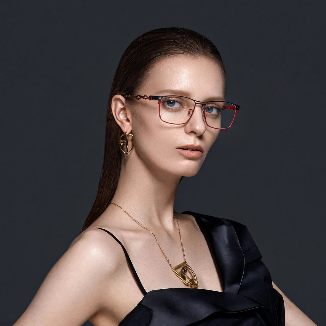 Model wearing Barledear Crimson Noir eyeglasses with statement square titanium frame in a lifestyle portrait