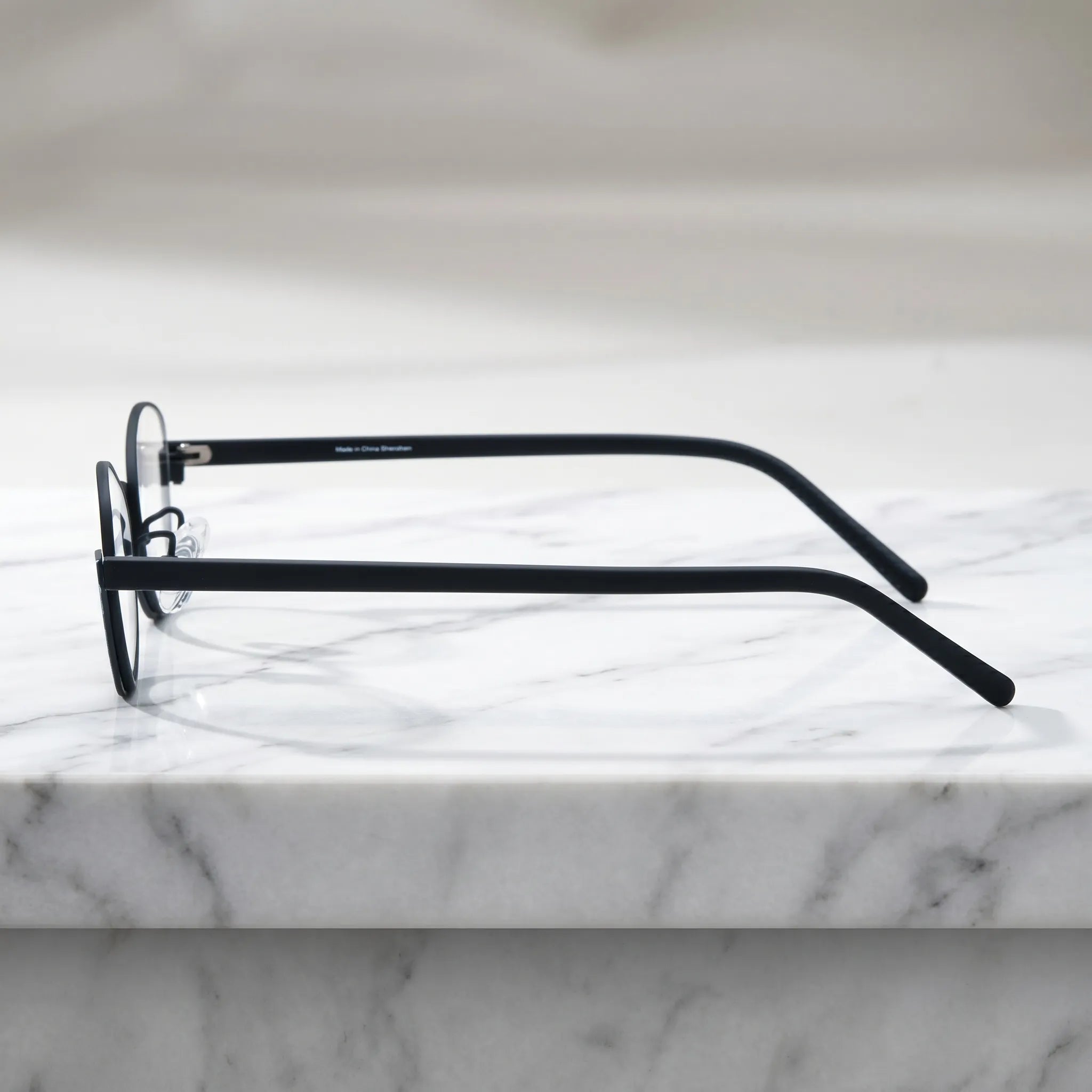 Barledear Crimson Noir eyeglasses angled side view showing slim temples adjustable nose pads and bridge detail