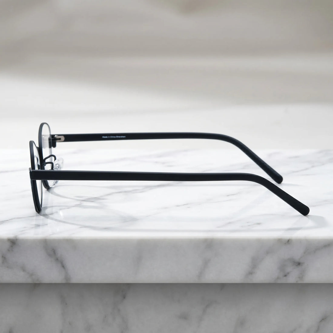 Barledear Crimson Noir eyeglasses angled side view showing slim temples adjustable nose pads and bridge detail