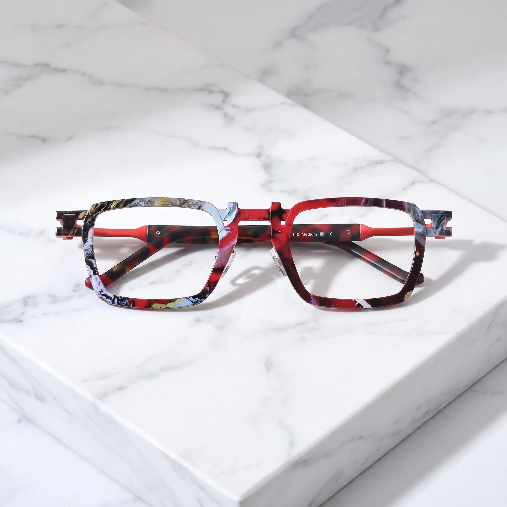 Barledear Crimson Noir Mosaic eyeglasses folded display showing pure titanium frame structure, red temple accents, and square full-rim design