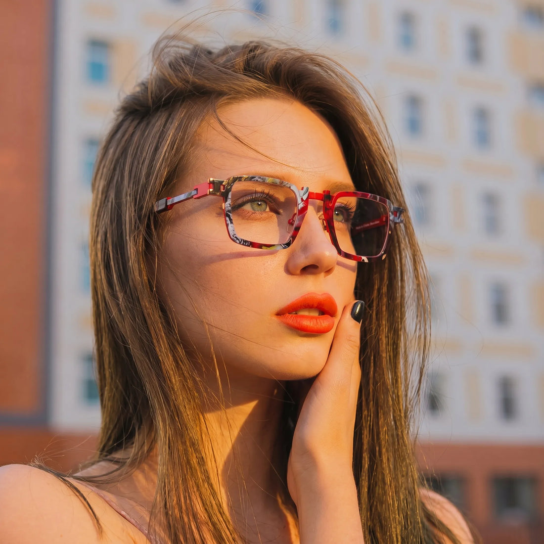 Model wearing Barledear Crimson Noir Mosaic geometric square titanium eyeglasses in a lifestyle portrait for high-impact everyday styling