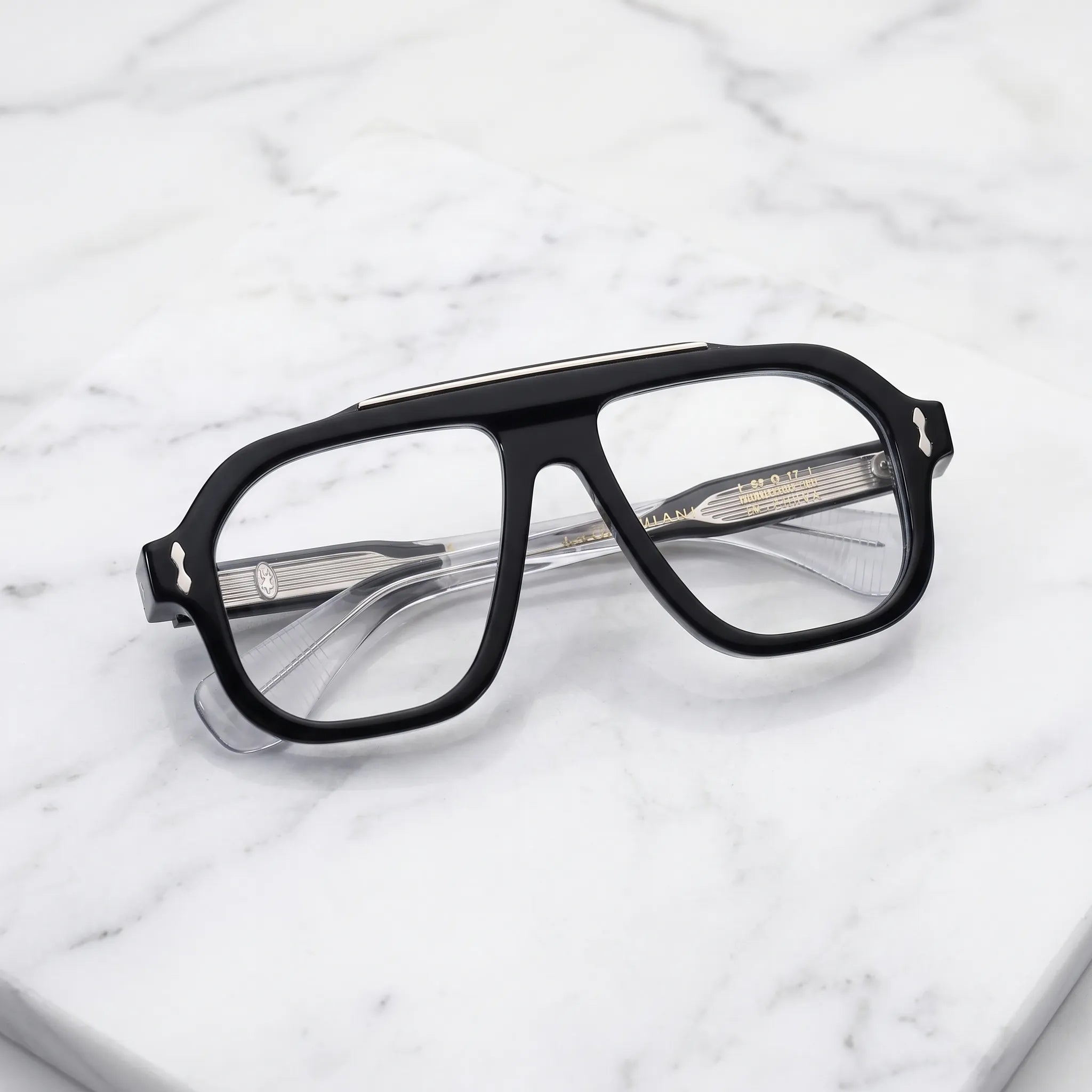 Barledear Crystal Noir eyeglasses folded display showing the polished black acetate front, transparent temples and decorative metal details