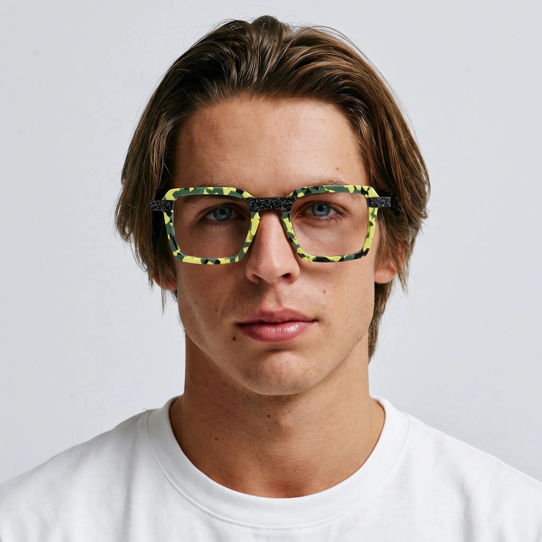 Model wearing Barledear Electric Moss Tortoise square eyeglasses in a colorful lifestyle portrait