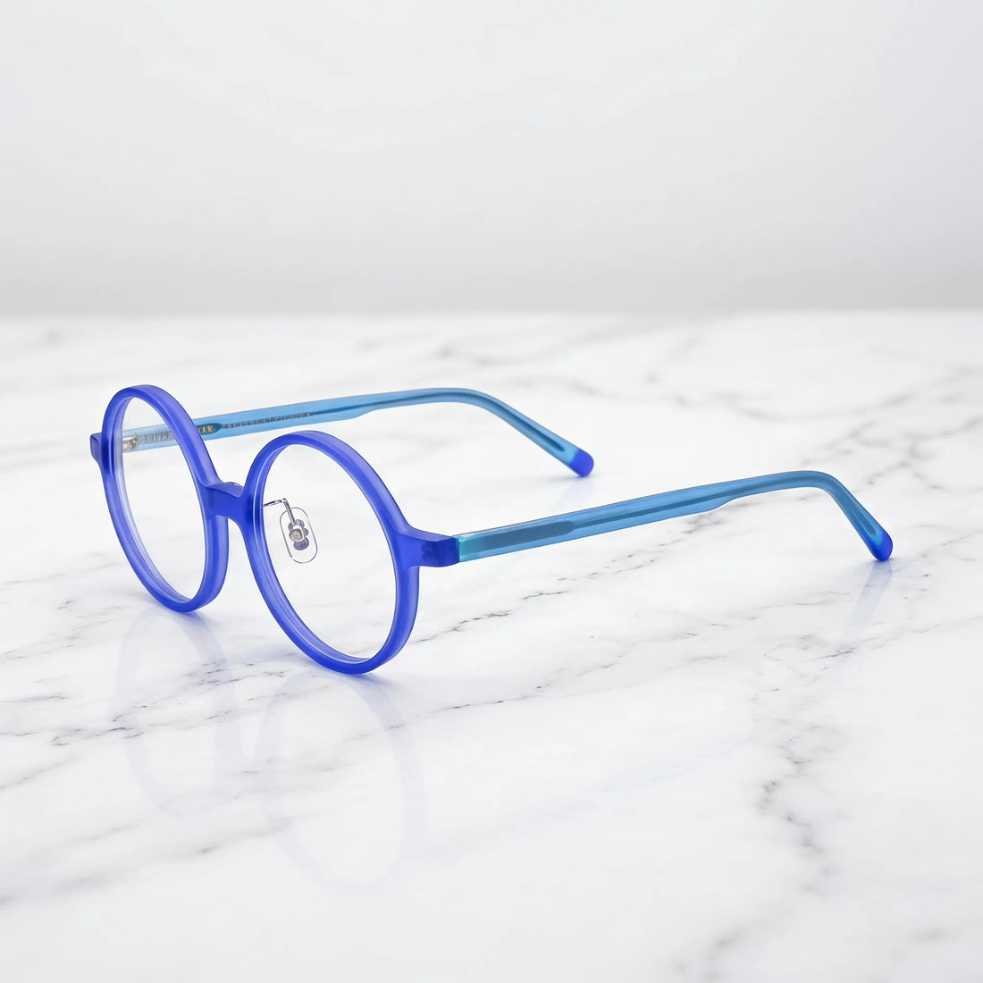 Barledear Frosted Iris Blue round acetate eyeglasses angled side view showing slim acetate temples, bridge detail, and adjustable nose pads