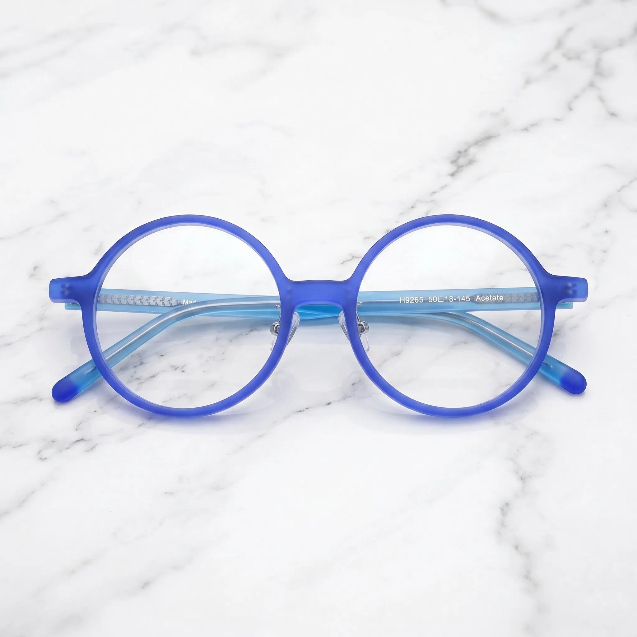 Barledear Frosted Iris Blue round acetate eyeglasses folded display showing frame shape, slim temples, and contrast blue temple tips