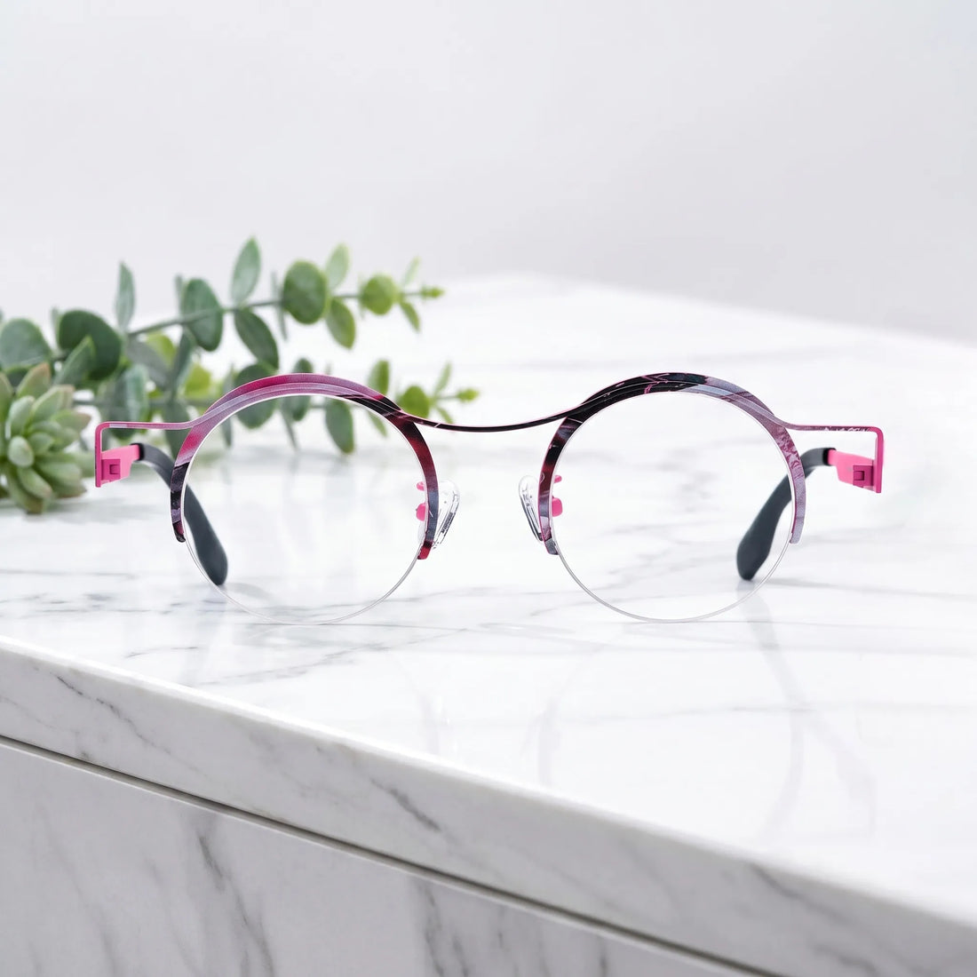Barledear Fuchsia Marble eyeglasses shown in a clean lifestyle front view with retro round semi-rimless pure titanium frame