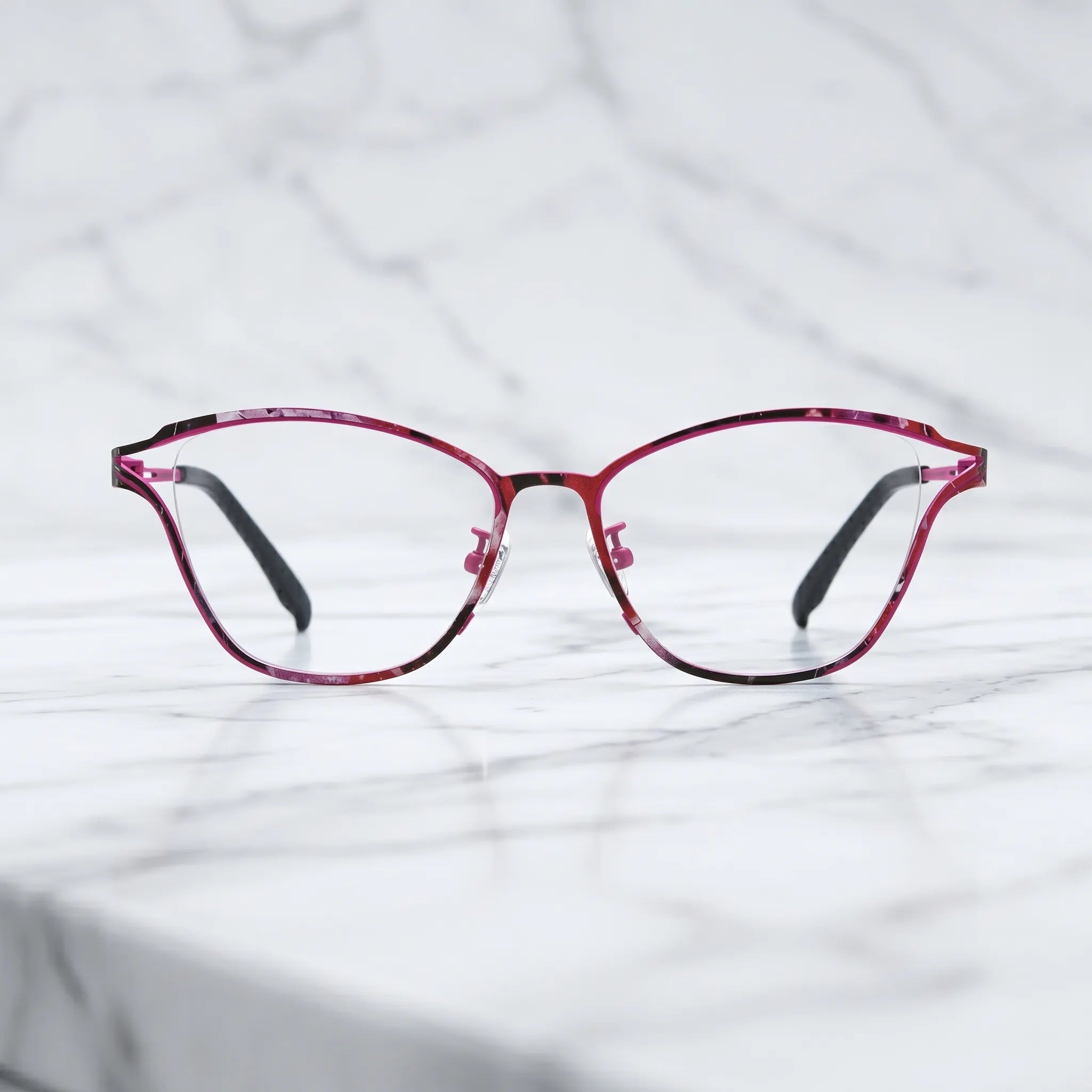 Barledear Fuchsia Mosaic eyeglasses shown in a clean lifestyle front view with pink mosaic titanium frame detail