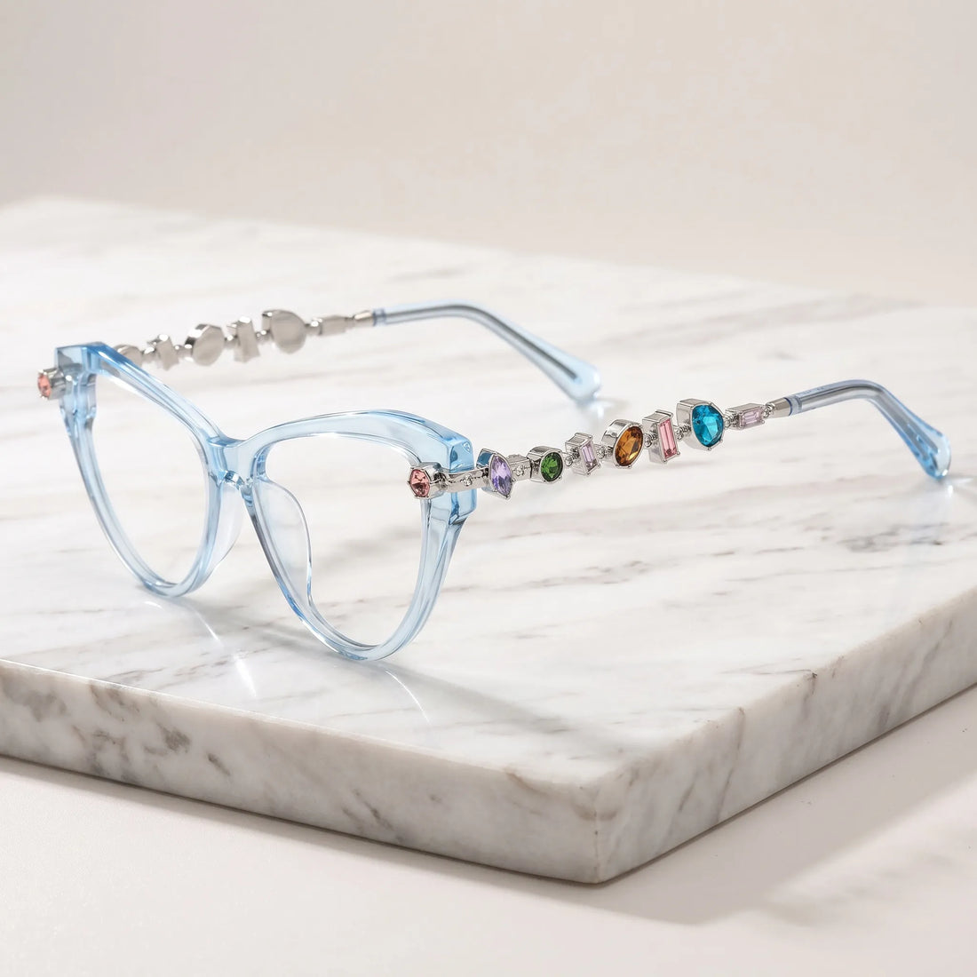 Barledear Glacier Blue eyeglasses angled side view highlighting multicolor geometric crystal accents along the silver-tone temples