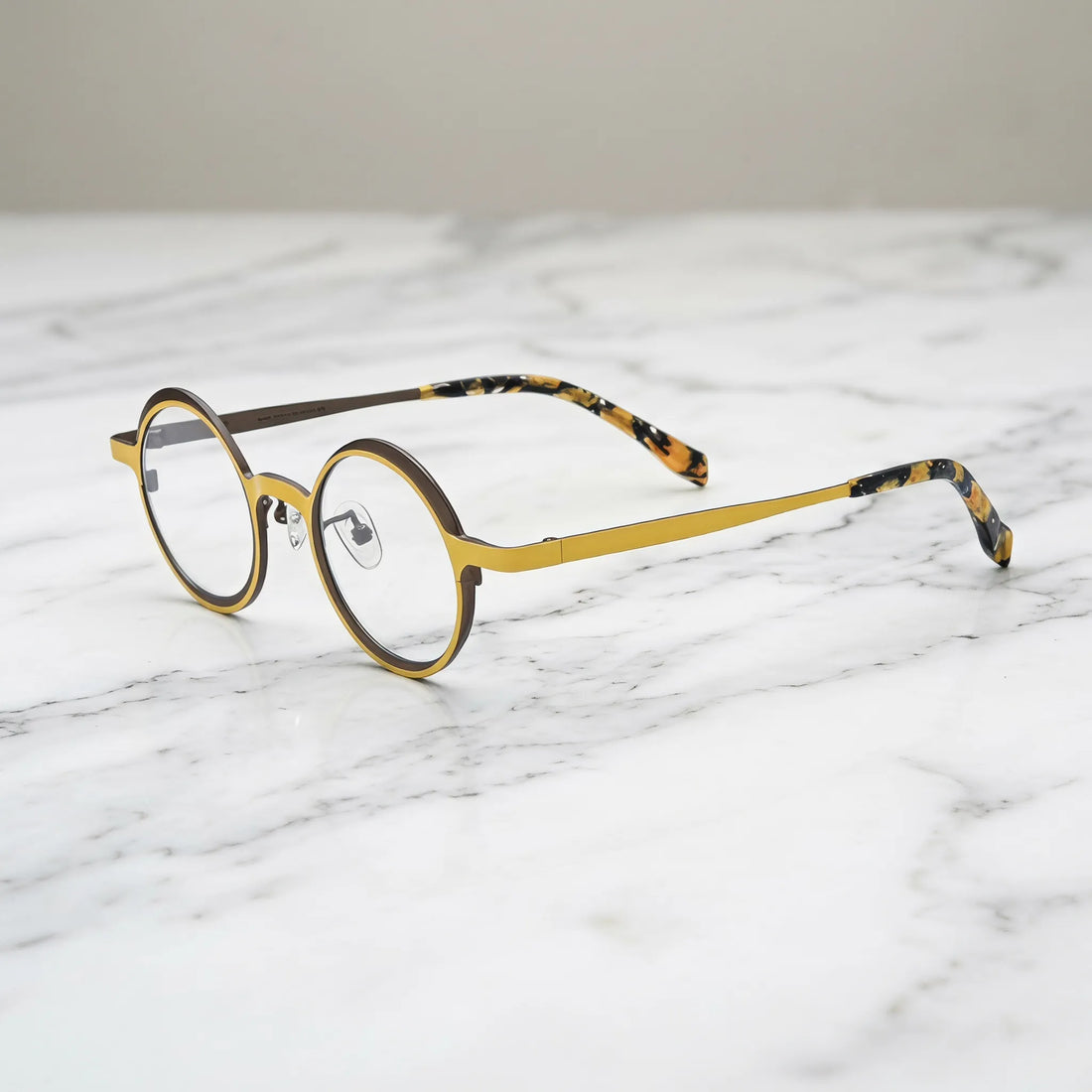 Barledear Golden Walnut round pure titanium eyeglasses angled side view showing slim temples bridge construction and patterned temple tips