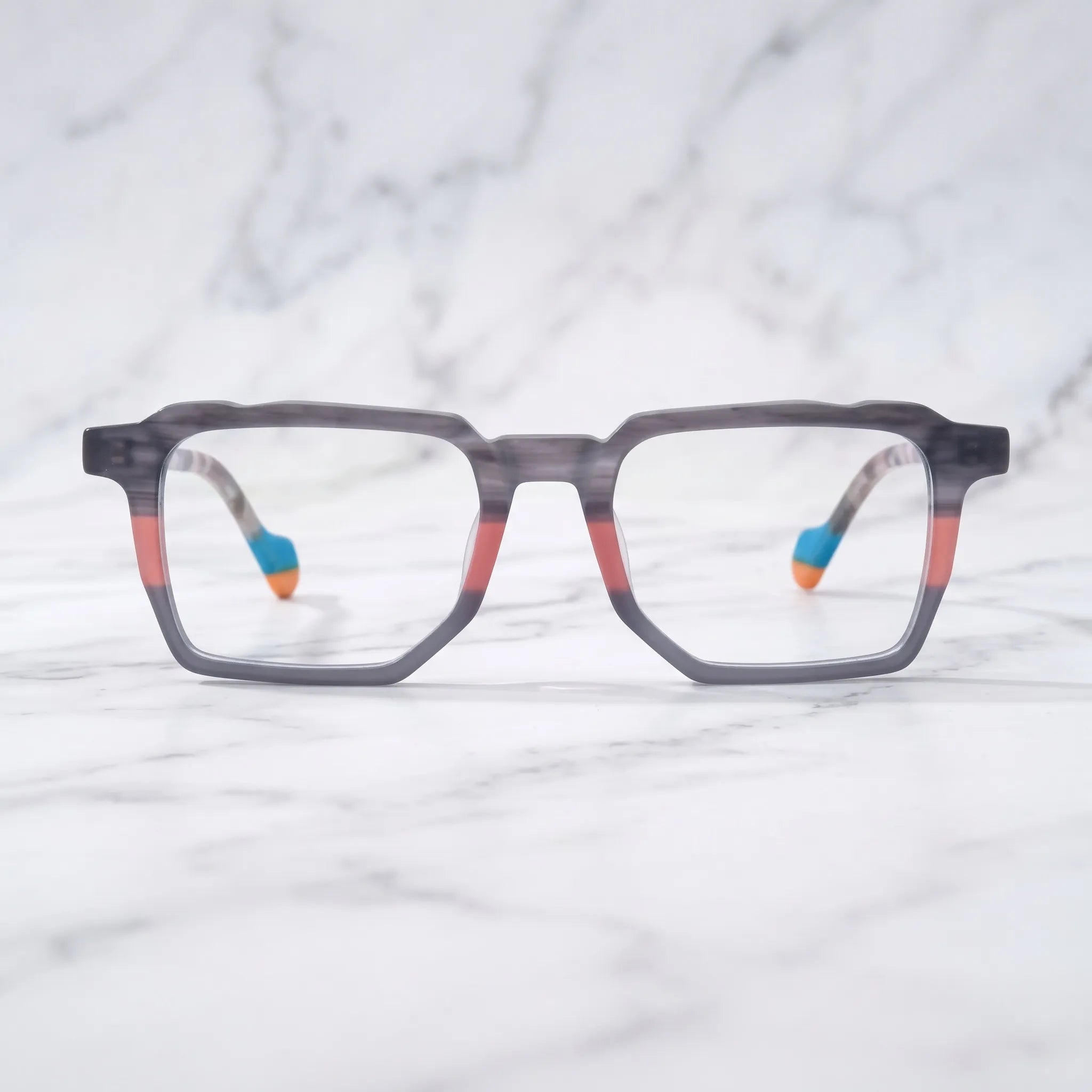 Barledear Graphite Blush eyeglasses shown in a clean lifestyle setting with a gray coral geometric frame
