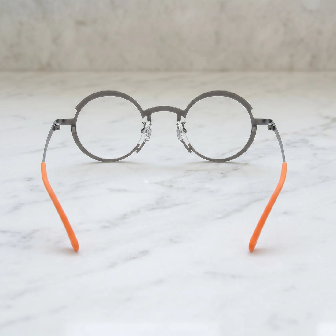 Barledear Graphite Gray Citrus Orange eyeglasses back view showing the round full-rim frame structure, nose pads, temples, and color-block details