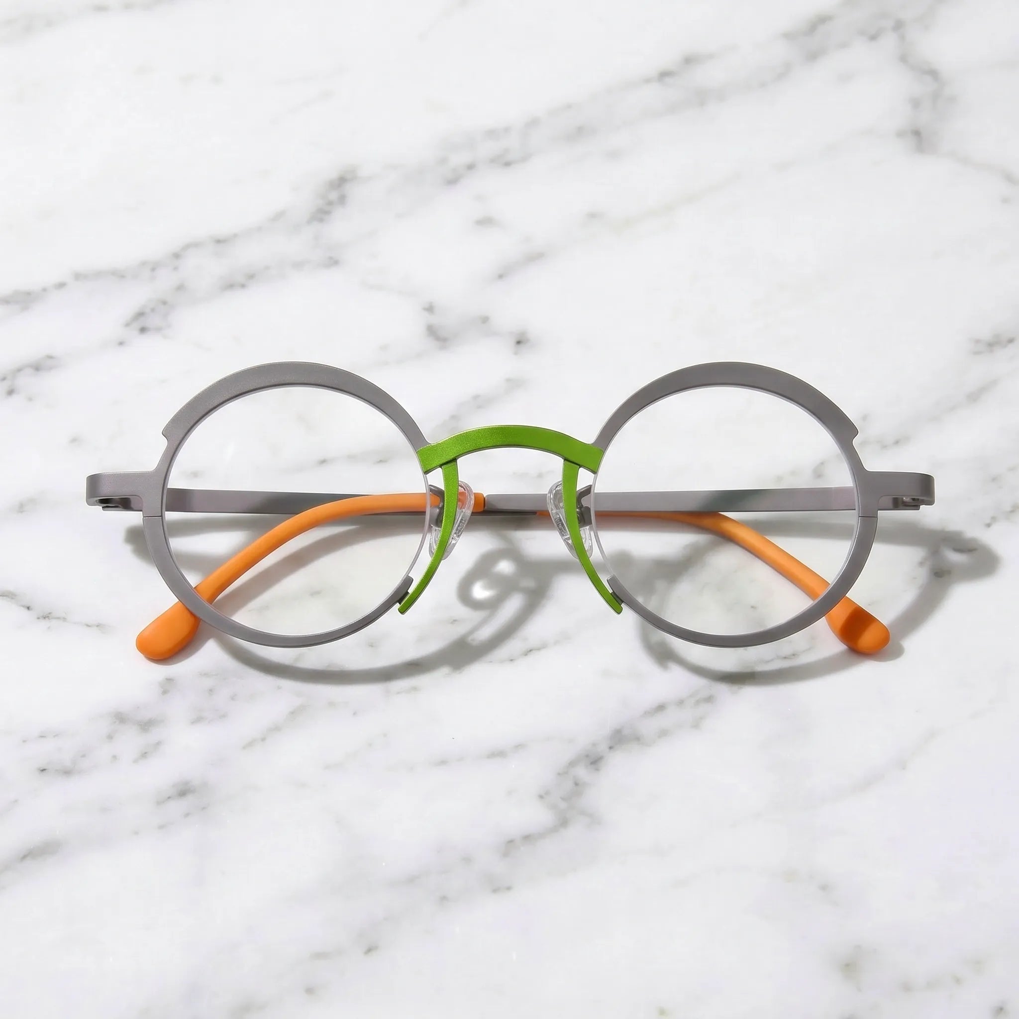 Barledear Graphite Gray Citrus Orange eyeglasses folded display showing the lightweight full-rim structure, slim titanium temples, and temple-tip details