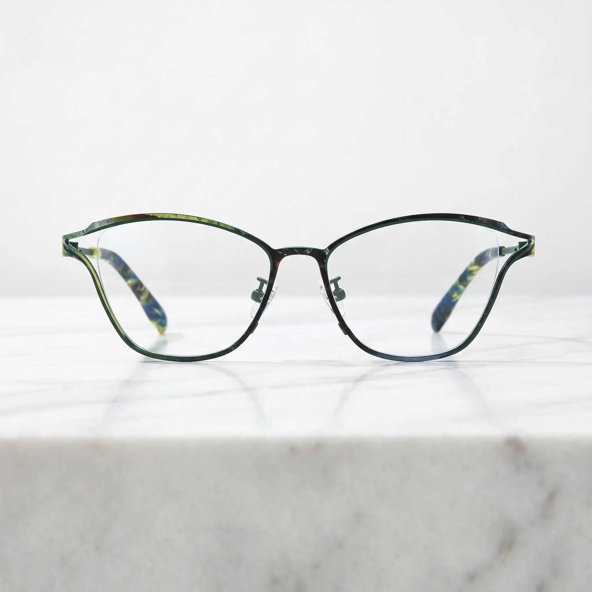 Barledear Green Mosaic eyeglasses shown in a clean lifestyle front view with colorful titanium frame detail
