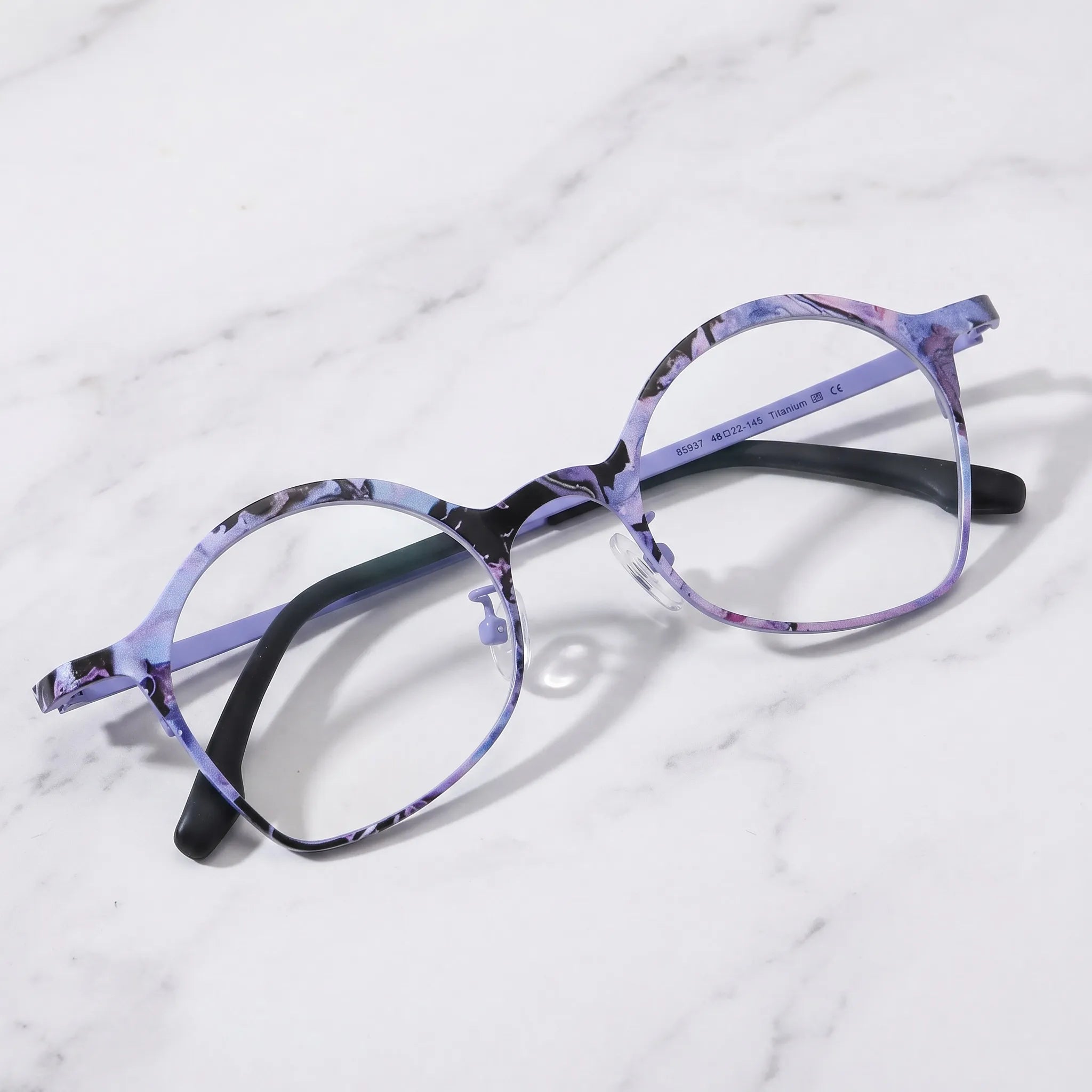 Barledear Lavender Ink Purple eyeglasses folded display showing patterned titanium frame and slim temples