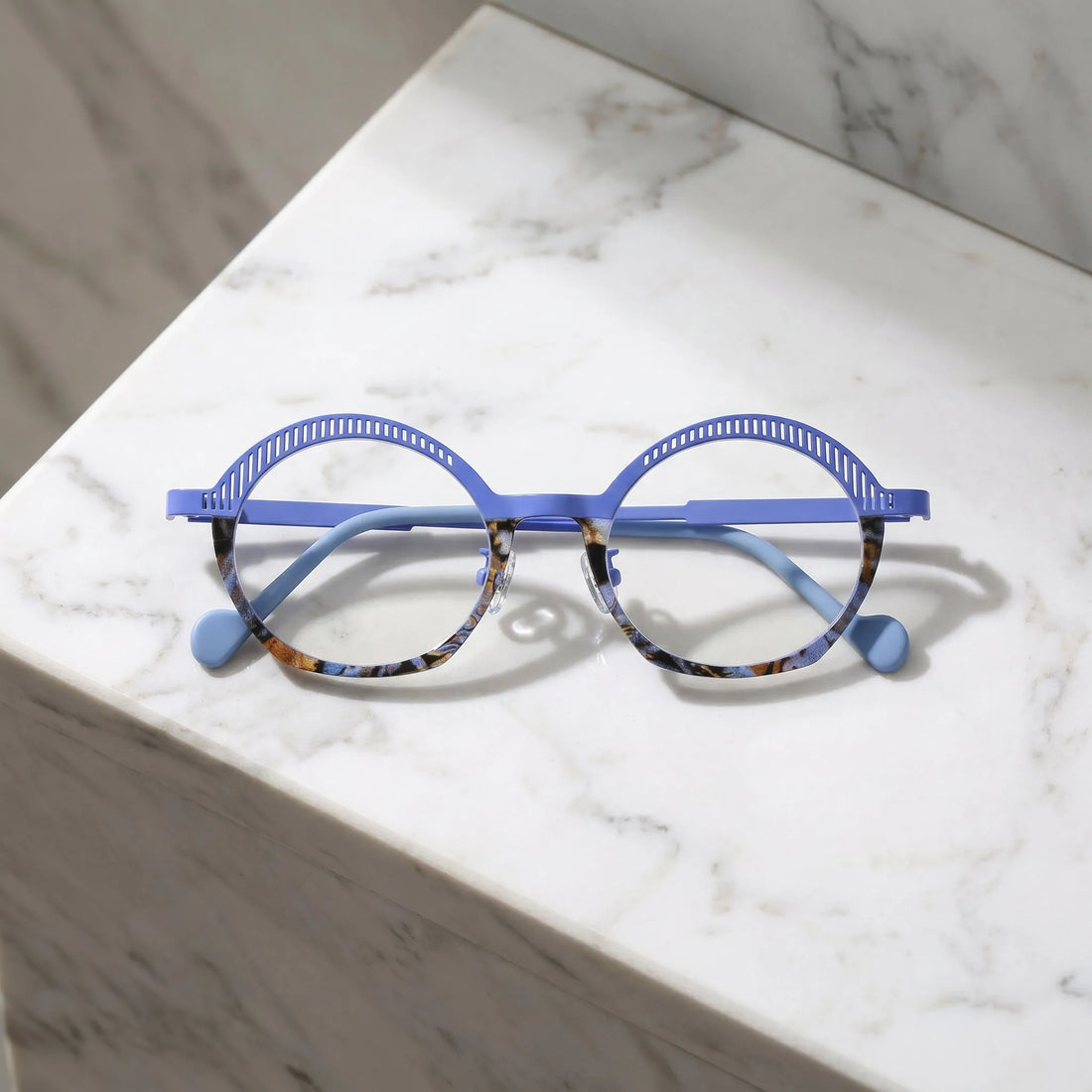 Barledear Lavender Mosaic eyeglasses folded display showing slim titanium temples, clear nose pads, and artistic oval frame design