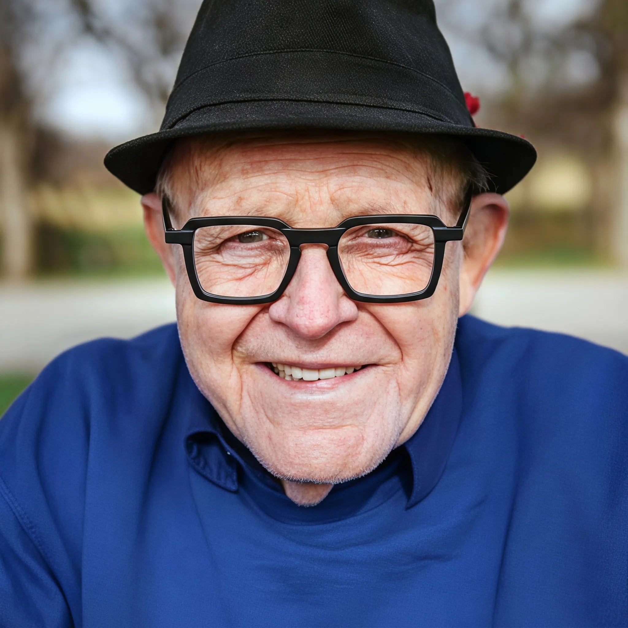 Model wearing Barledear Matte Onyx square eyeglasses in a minimalist lifestyle portrait