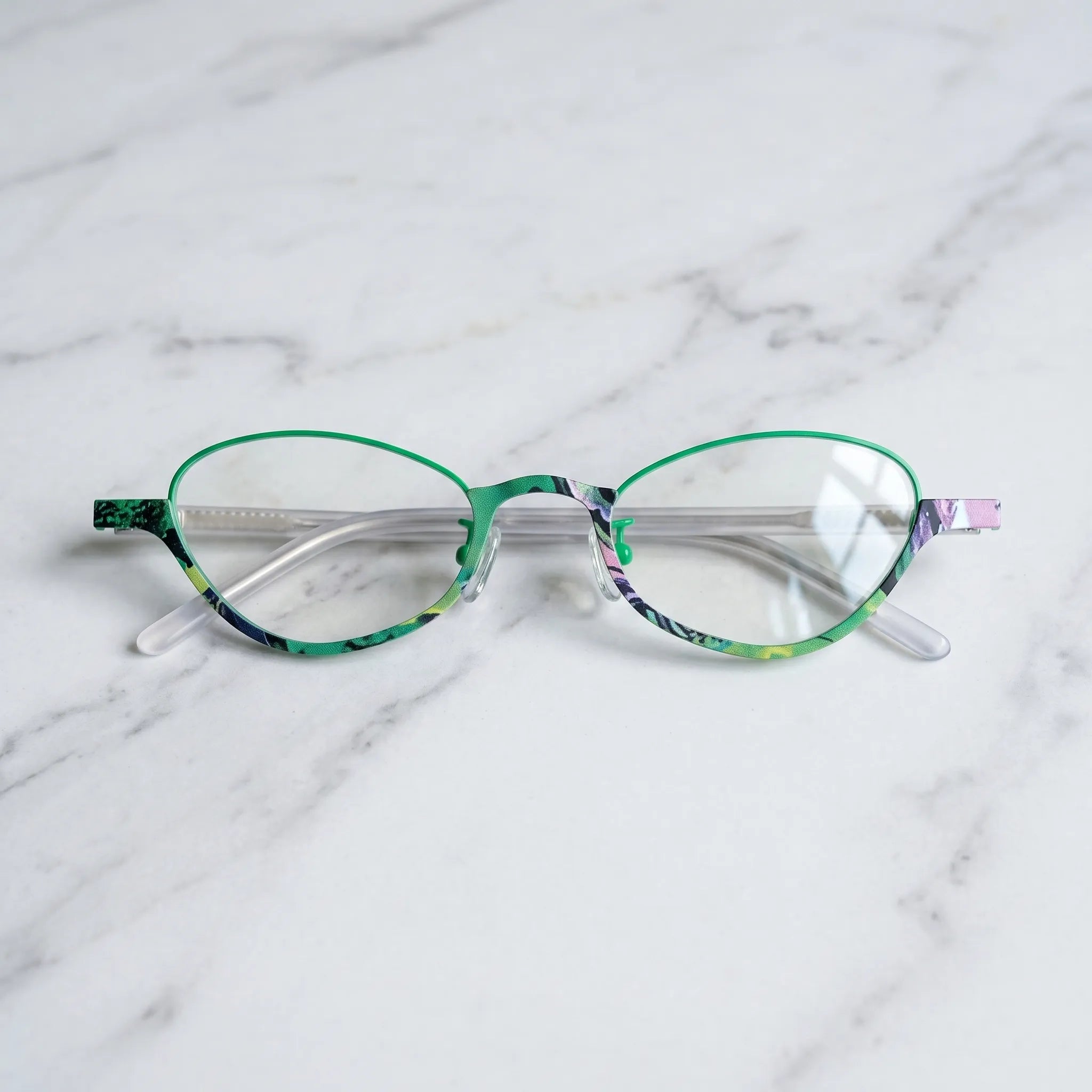 Barledear Meadow Jade eyeglasses folded display showing green titanium front and clear patterned temple arms