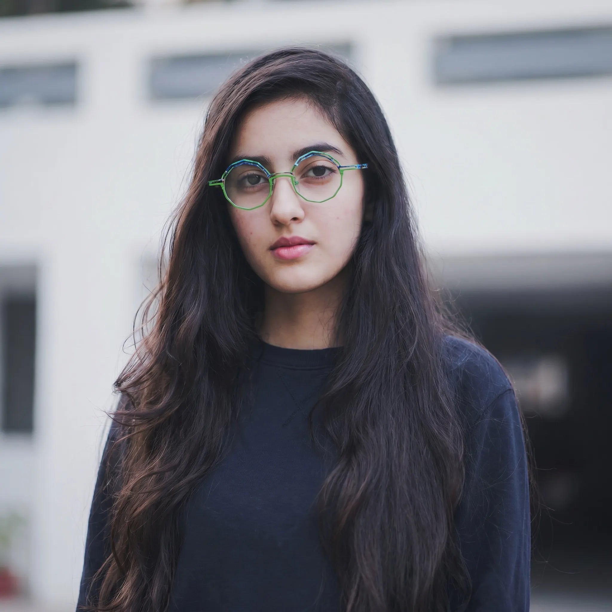 Model wearing Barledear Meadow Lime eyeglasses in a lifestyle portrait