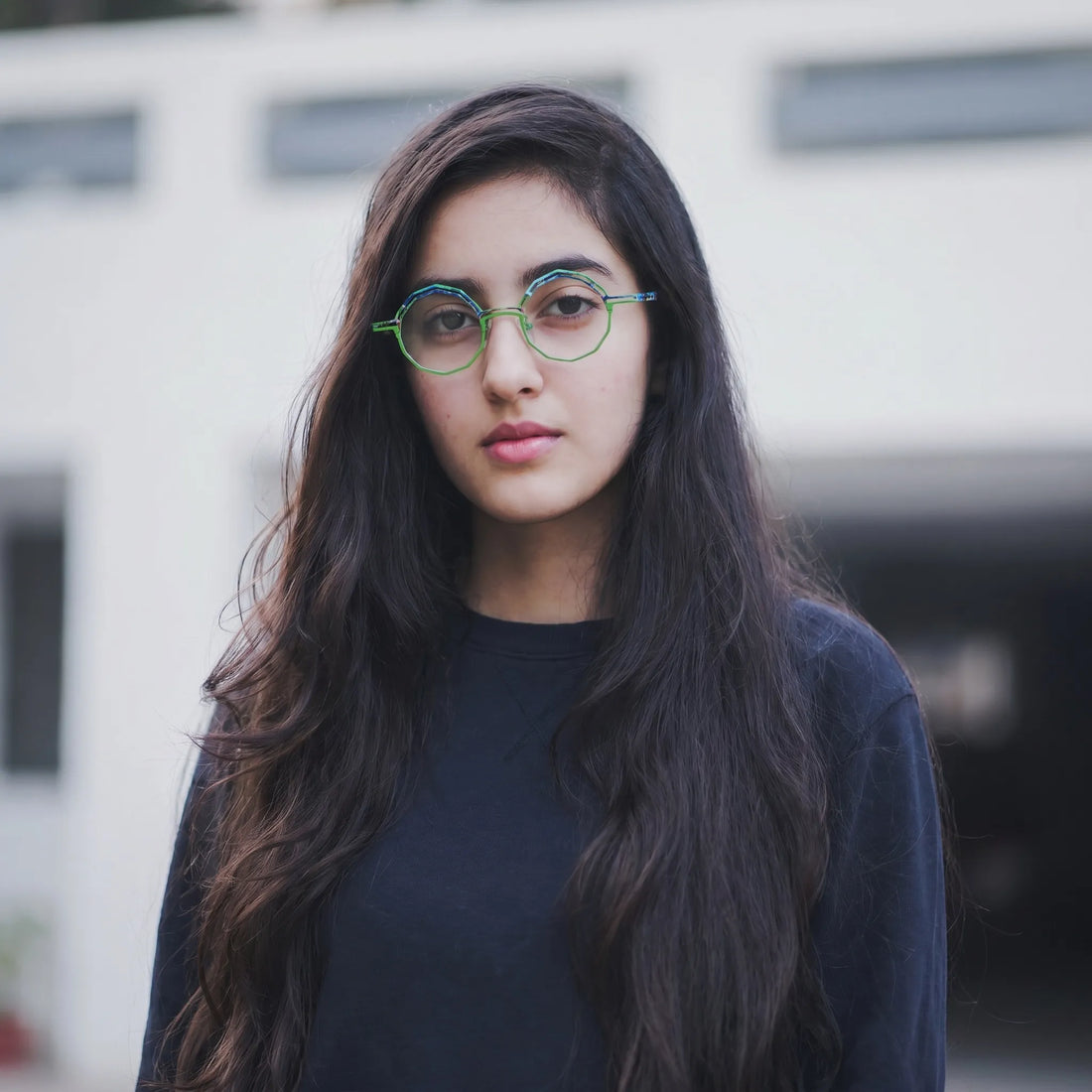 Model wearing Barledear Meadow Lime eyeglasses in a lifestyle portrait