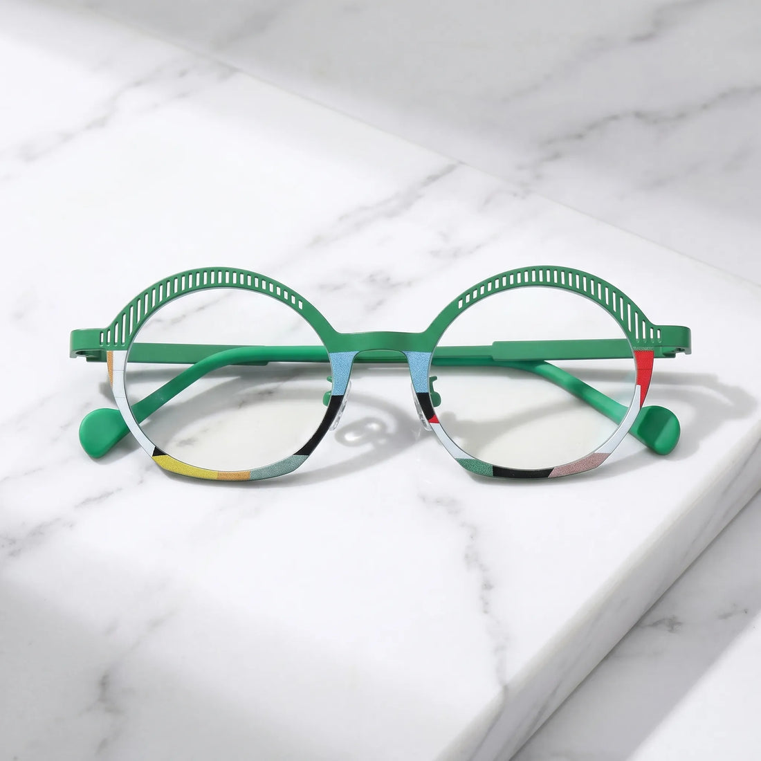 arledear Meadow Mosaic eyeglasses folded display showing slim green titanium temples, clear nose pads, and lightweight frame structure
