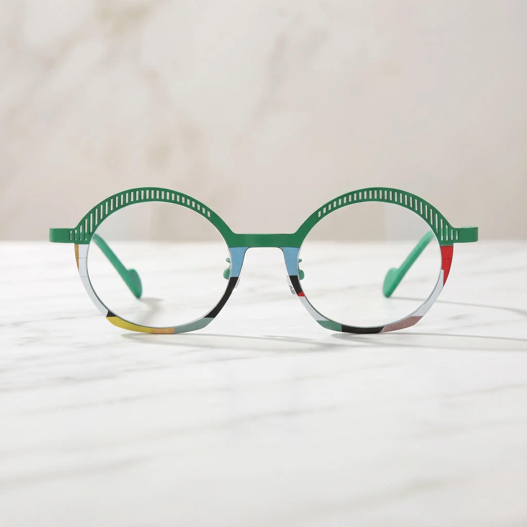 Barledear Meadow Mosaic eyeglasses shown in a clean lifestyle front view with green slotted browline and artistic multicolor rim accents
