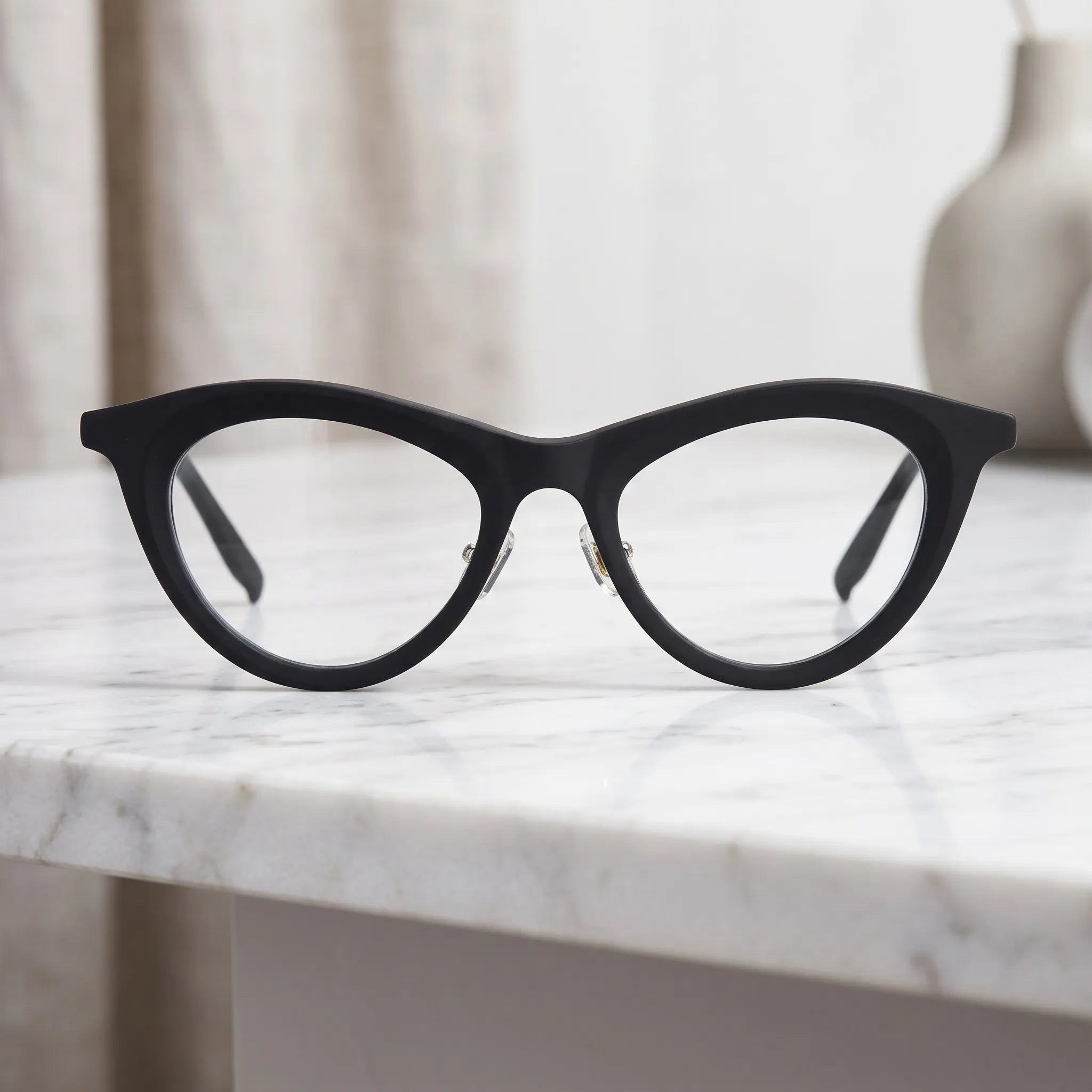 Barledear Midnight Matte cat-eye acetate eyeglasses shown in a clean lifestyle front view with a minimalist black finish