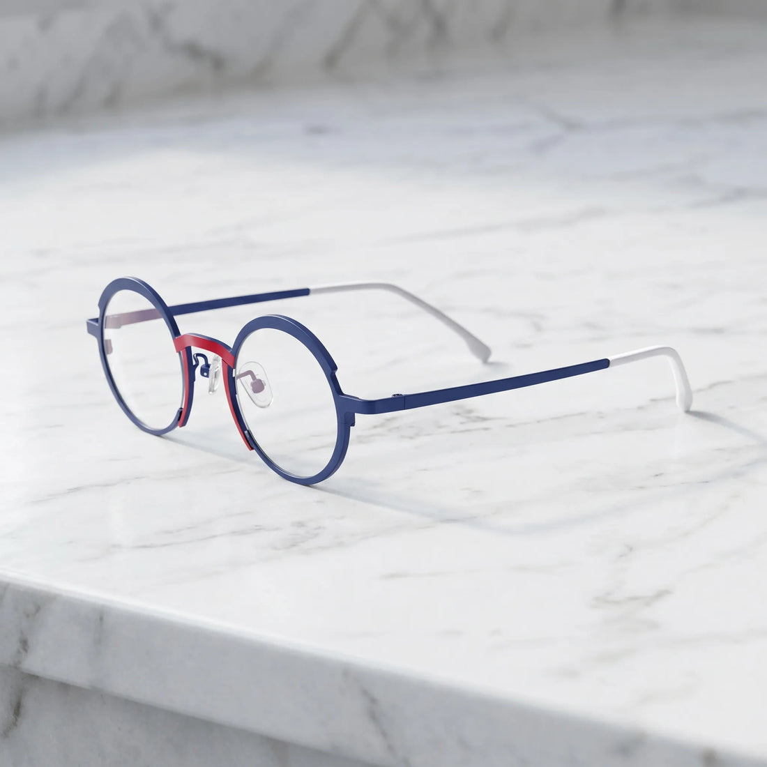 Barledear Midnight Navy Crimson Red eyeglasses angled side view showing adjustable nose pads, slim titanium temples, and bridge construction