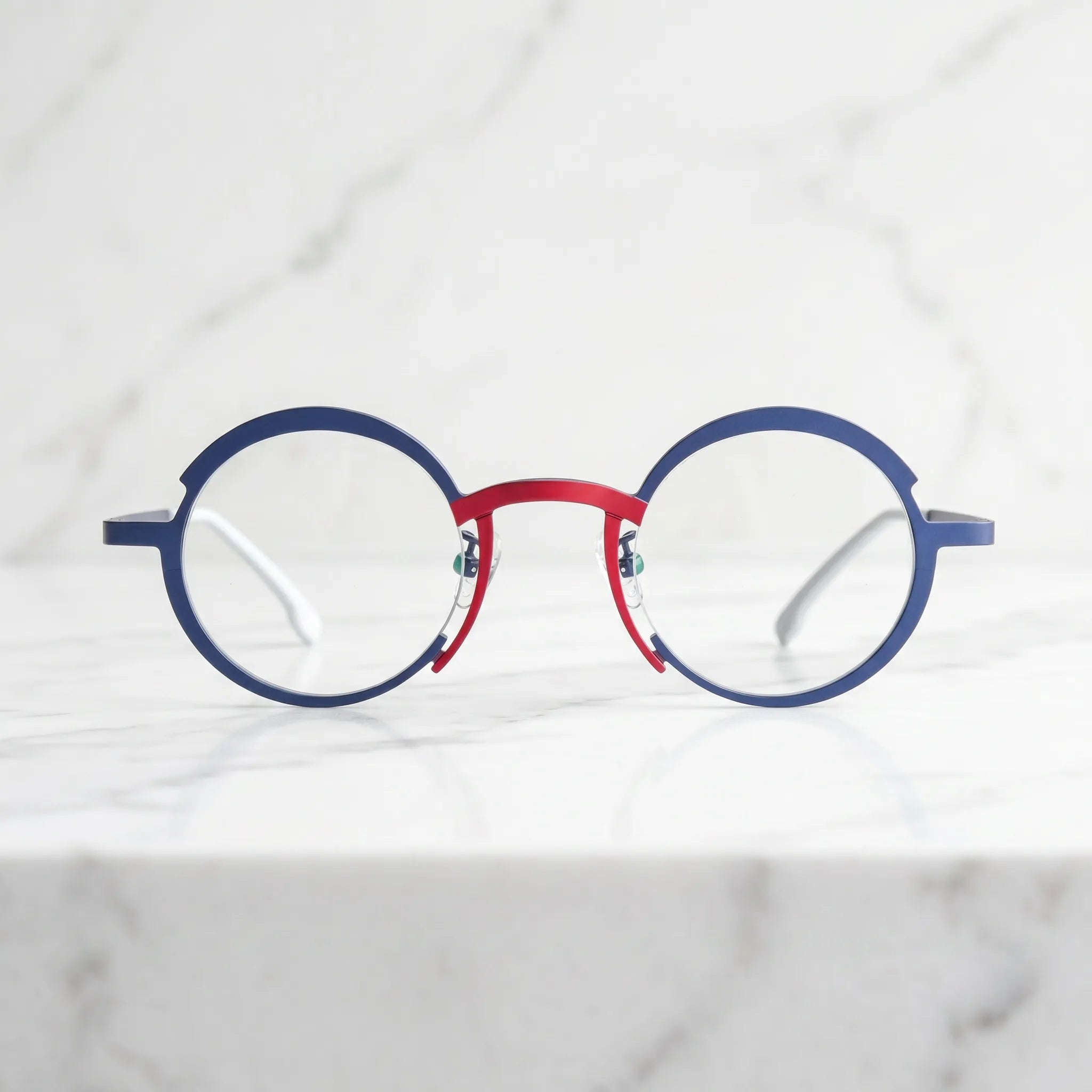 Barledear Midnight Navy Crimson Red eyeglasses lifestyle front view showing the artistic round titanium frame and contrasting color details