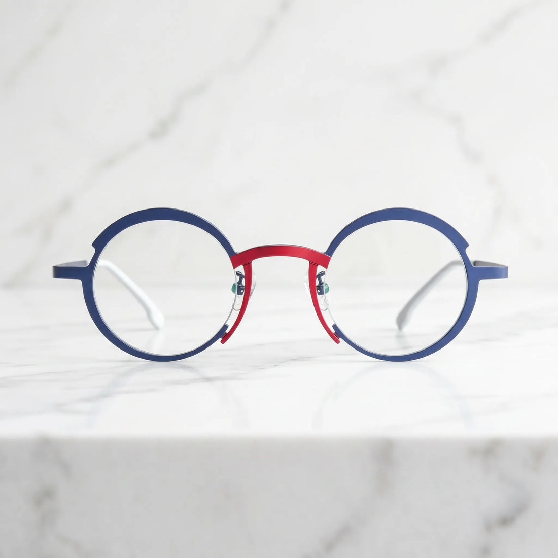 Barledear Midnight Navy Crimson Red eyeglasses lifestyle front view showing the artistic round titanium frame and contrasting color details