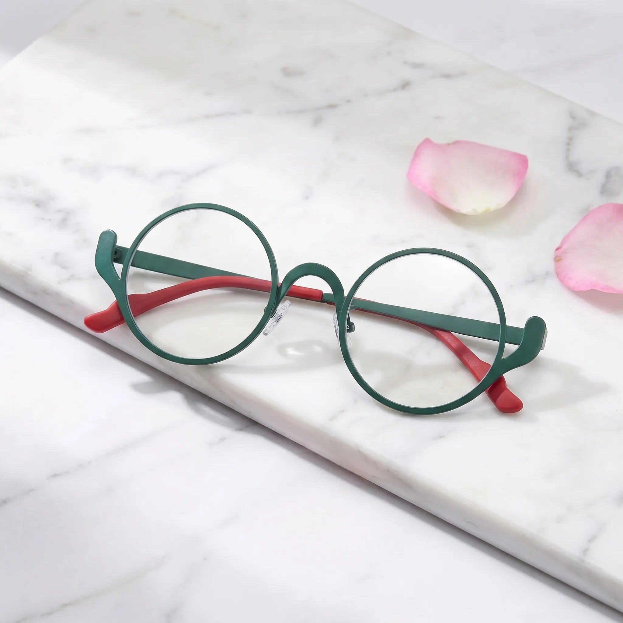 Barledear Mosaic Jade eyeglasses folded display showing the round frame shape, slim temples, and artistic color-spliced pure titanium construction
