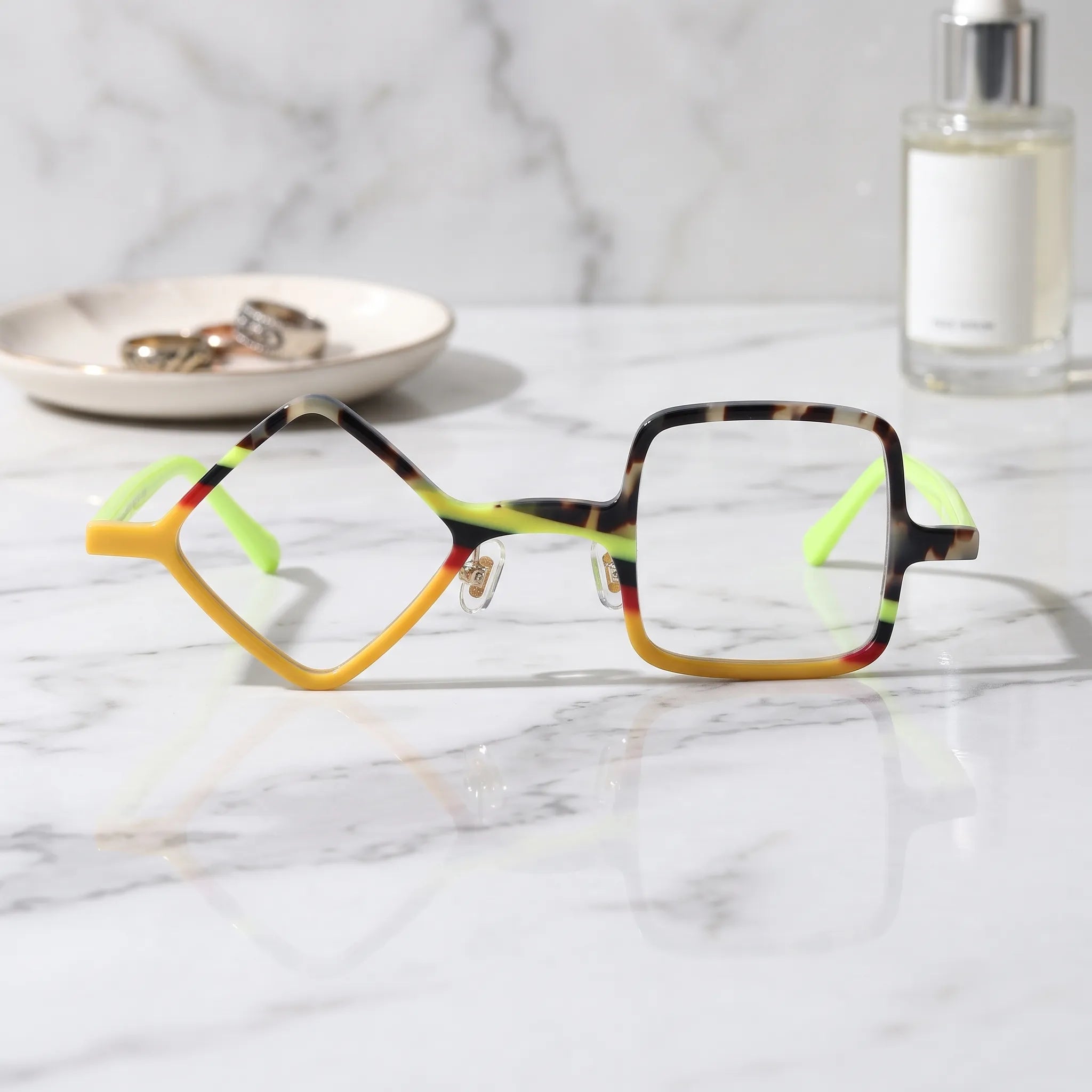 Barledear Neon Tortoise asymmetric geometric acetate eyeglasses shown in a clean lifestyle front display with yellow tortoiseshell details and vivid lime temples.