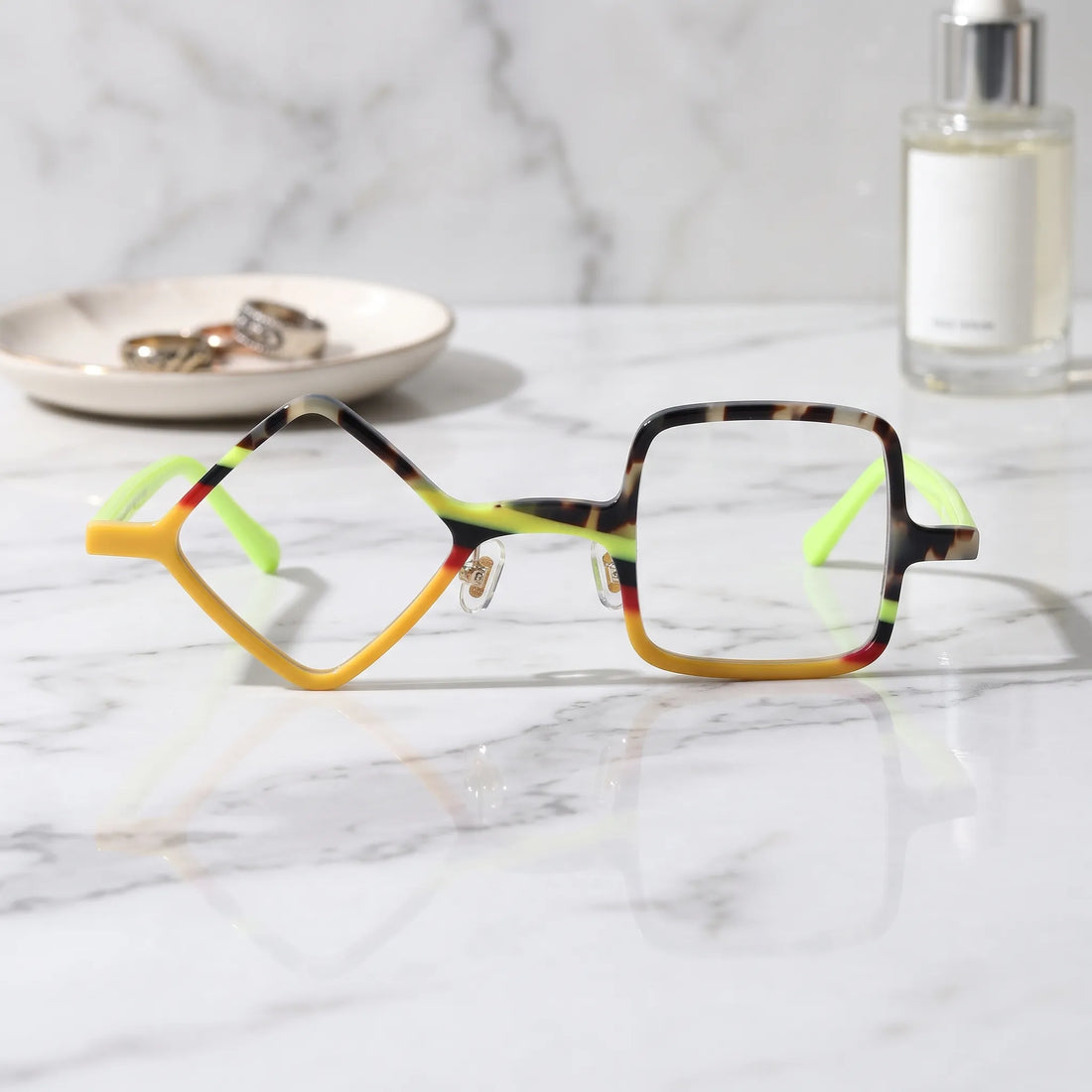 Barledear Neon Tortoise asymmetric geometric acetate eyeglasses shown in a clean lifestyle front display with yellow tortoiseshell details and vivid lime temples.