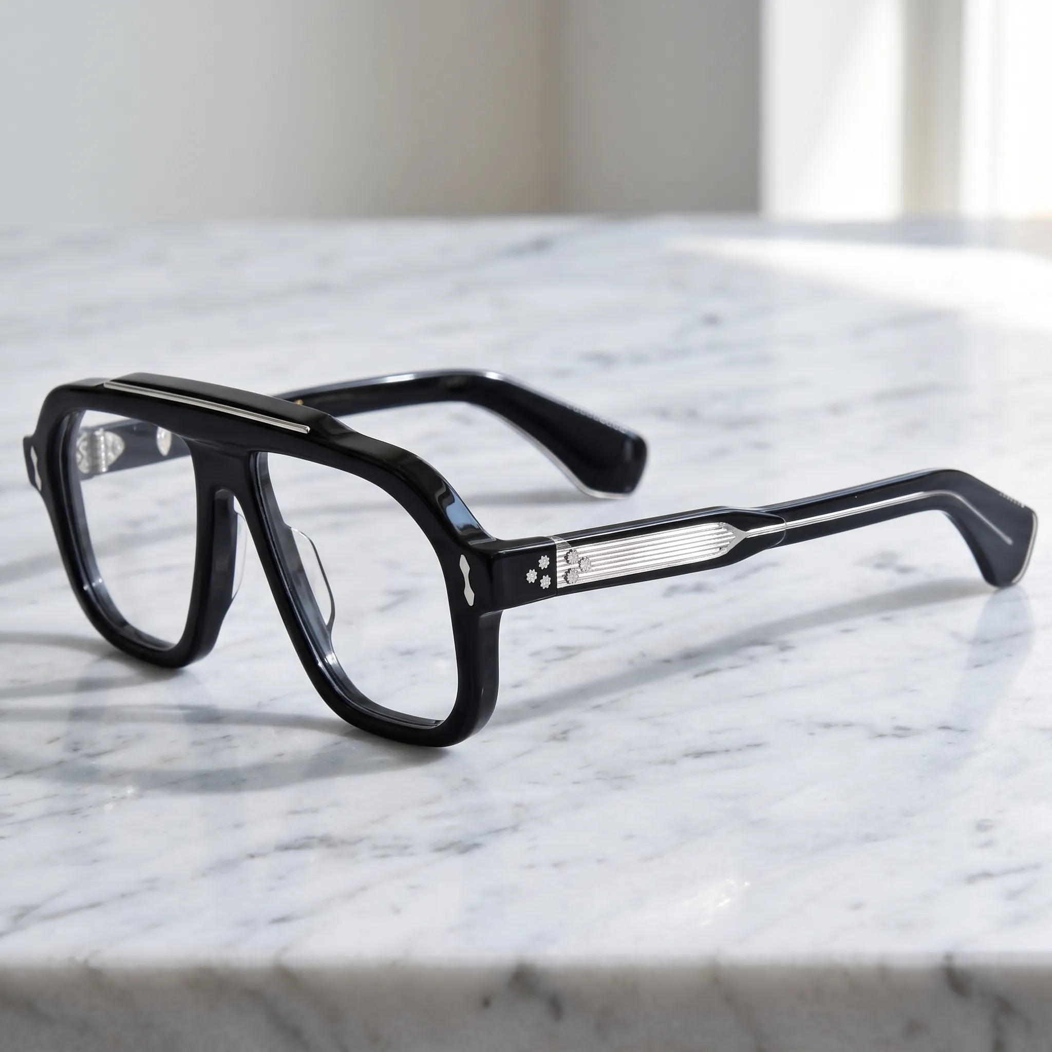 Barledear Obsidian Black eyeglasses angled side view showing polished black temples, silver-tone linear inlays and metal screw hinges