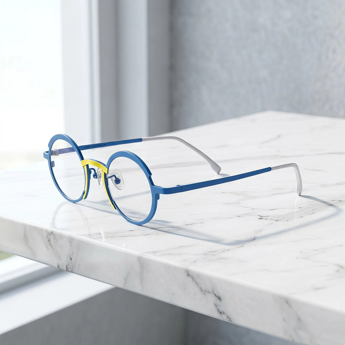 Barledear Ocean Blue Sunshine Yellow eyeglasses angled side view showing adjustable nose pads, slim titanium temples, and bridge construction