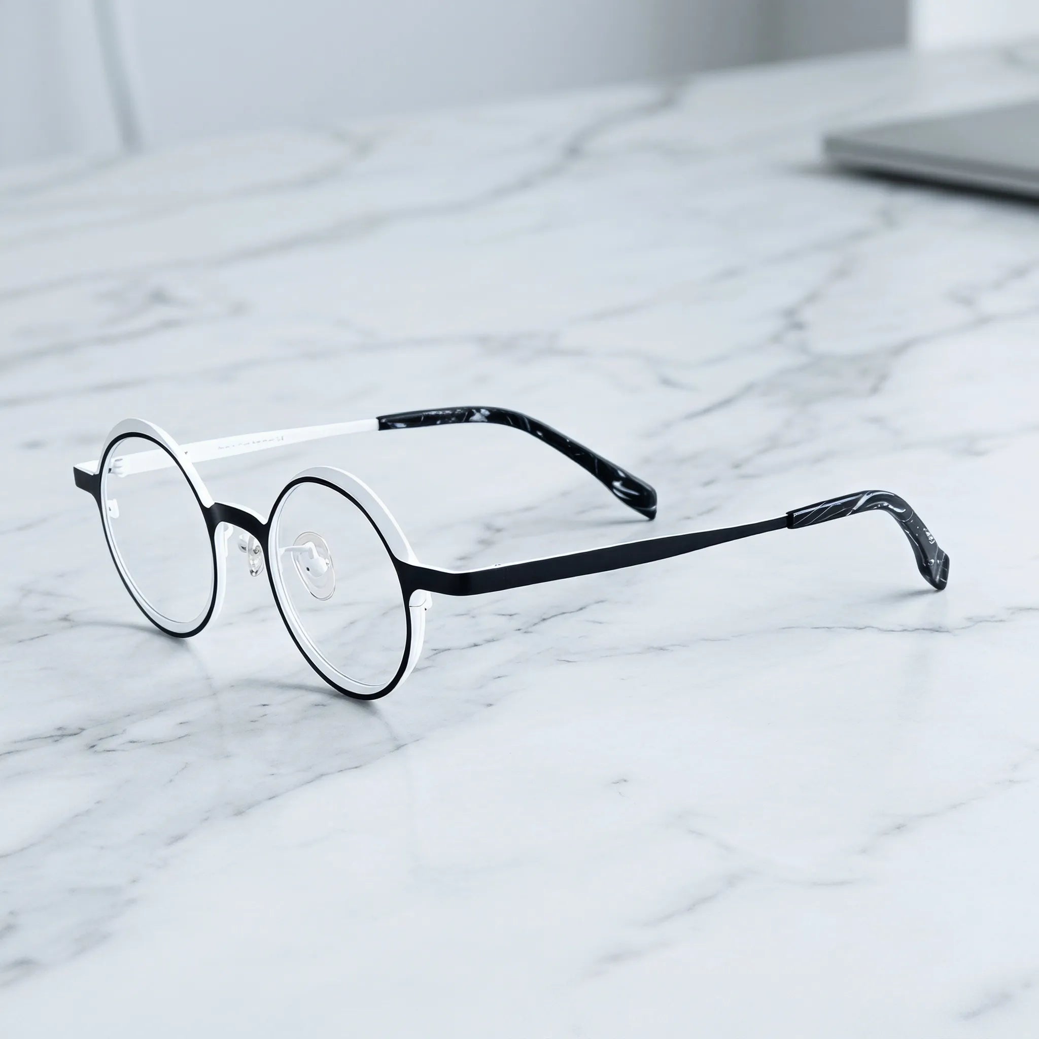 Barledear Onyx Crystal round pure titanium eyeglasses angled side view showing slim temples bridge construction and patterned temple tips