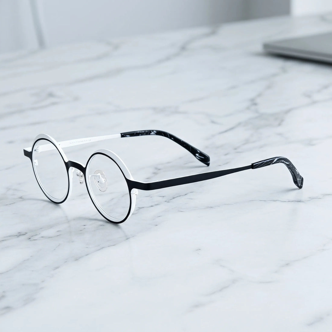 Barledear Onyx Crystal round pure titanium eyeglasses angled side view showing slim temples bridge construction and patterned temple tips