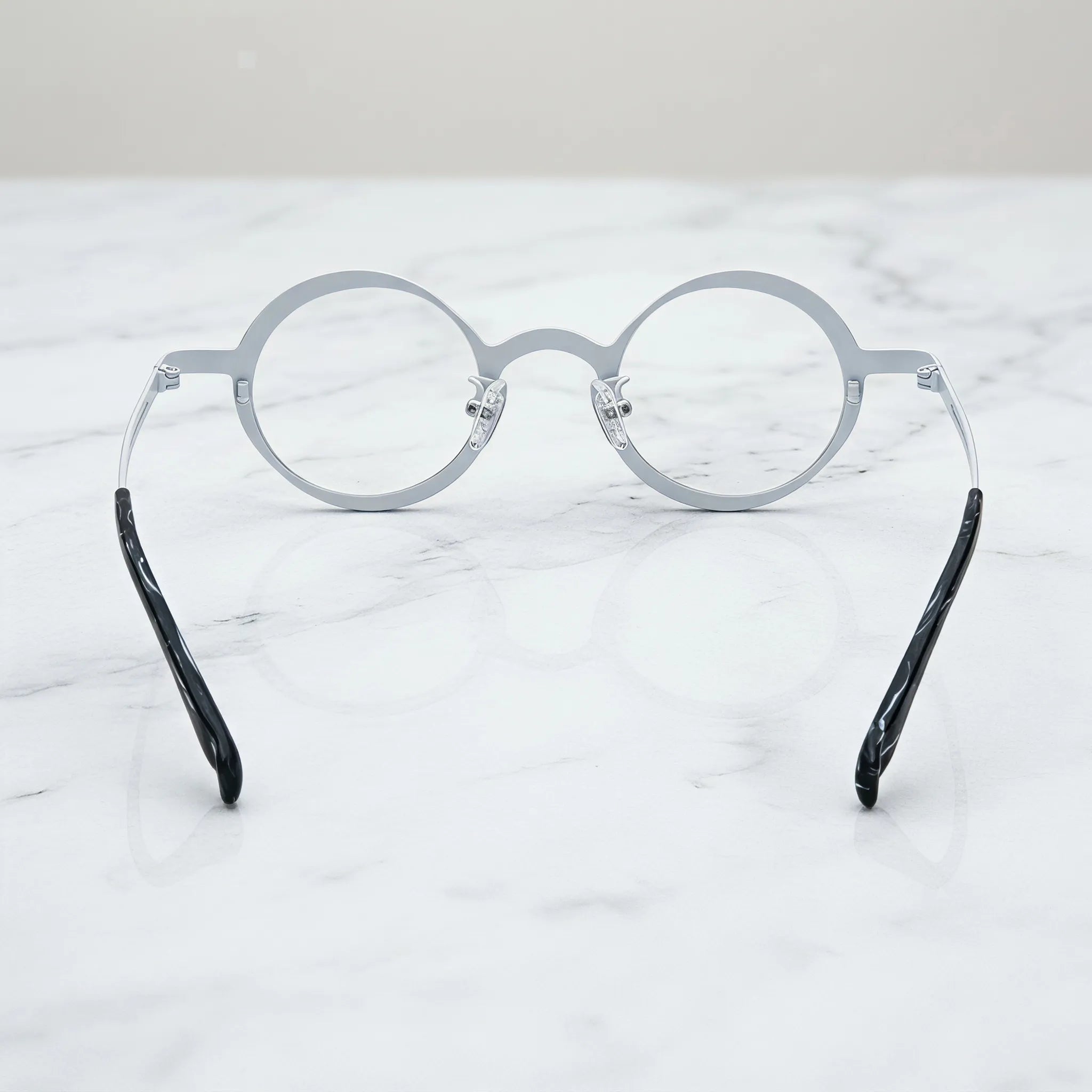Barledear Onyx Crystal round pure titanium eyeglasses back view showing the full-rim structure adjustable silicone nose pads and temple shape