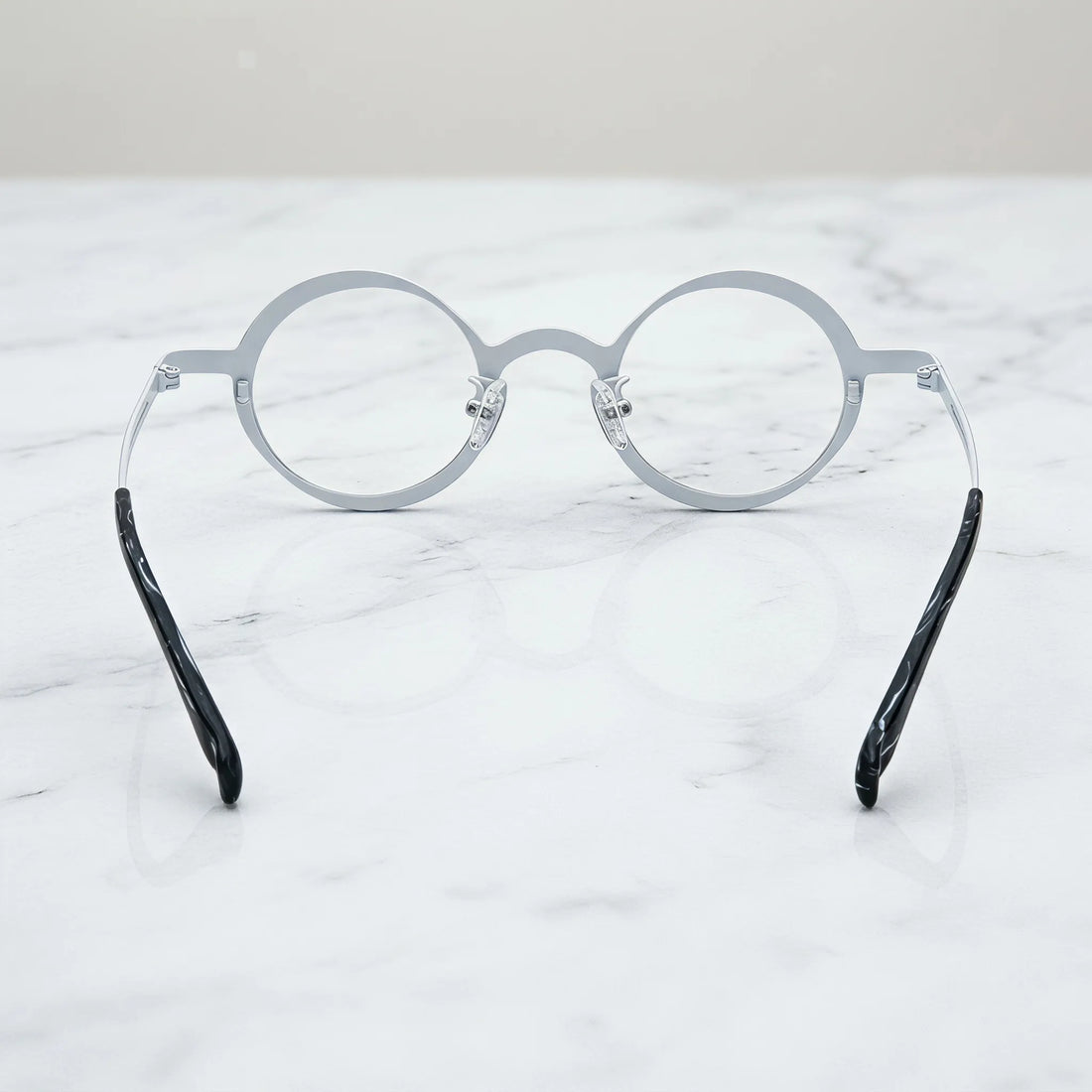 Barledear Onyx Crystal round pure titanium eyeglasses back view showing the full-rim structure adjustable silicone nose pads and temple shape