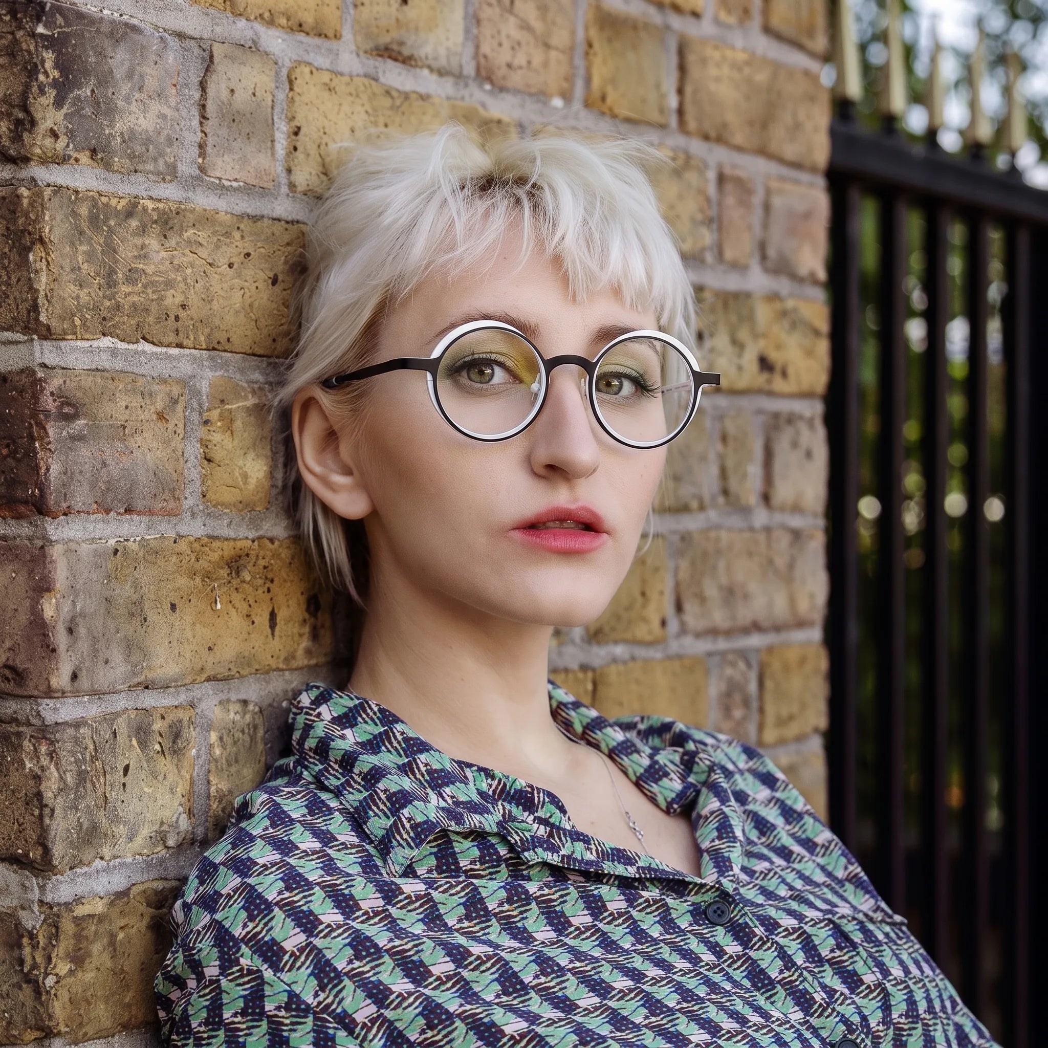 Model wearing Barledear Onyx Crystal round pure titanium eyeglasses in a lifestyle portrait showing a lightweight design for everyday wear