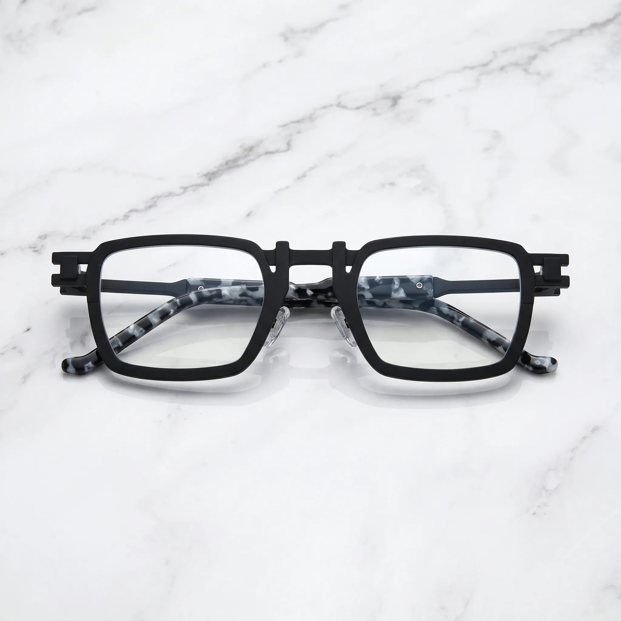 Barledear Onyx Smoke Marble eyeglasses folded display showing pure titanium frame structure, smoke marble temples, and square full-rim design