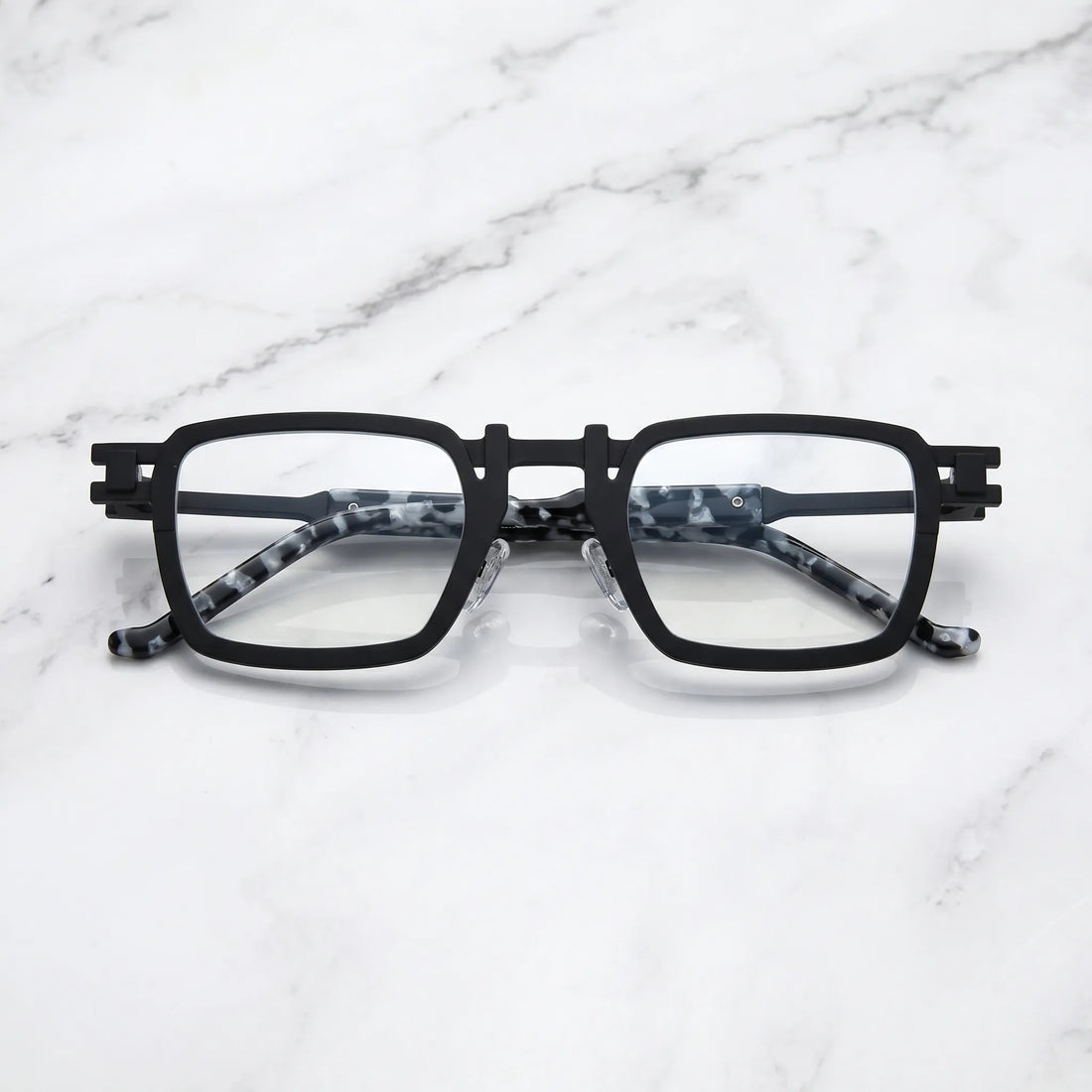 Barledear Onyx Smoke Marble eyeglasses folded display showing pure titanium frame structure, smoke marble temples, and square full-rim design